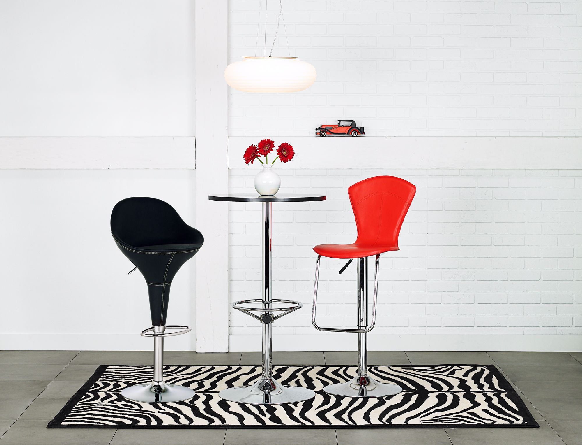 A zebra rug anchors this contemporary dining room.