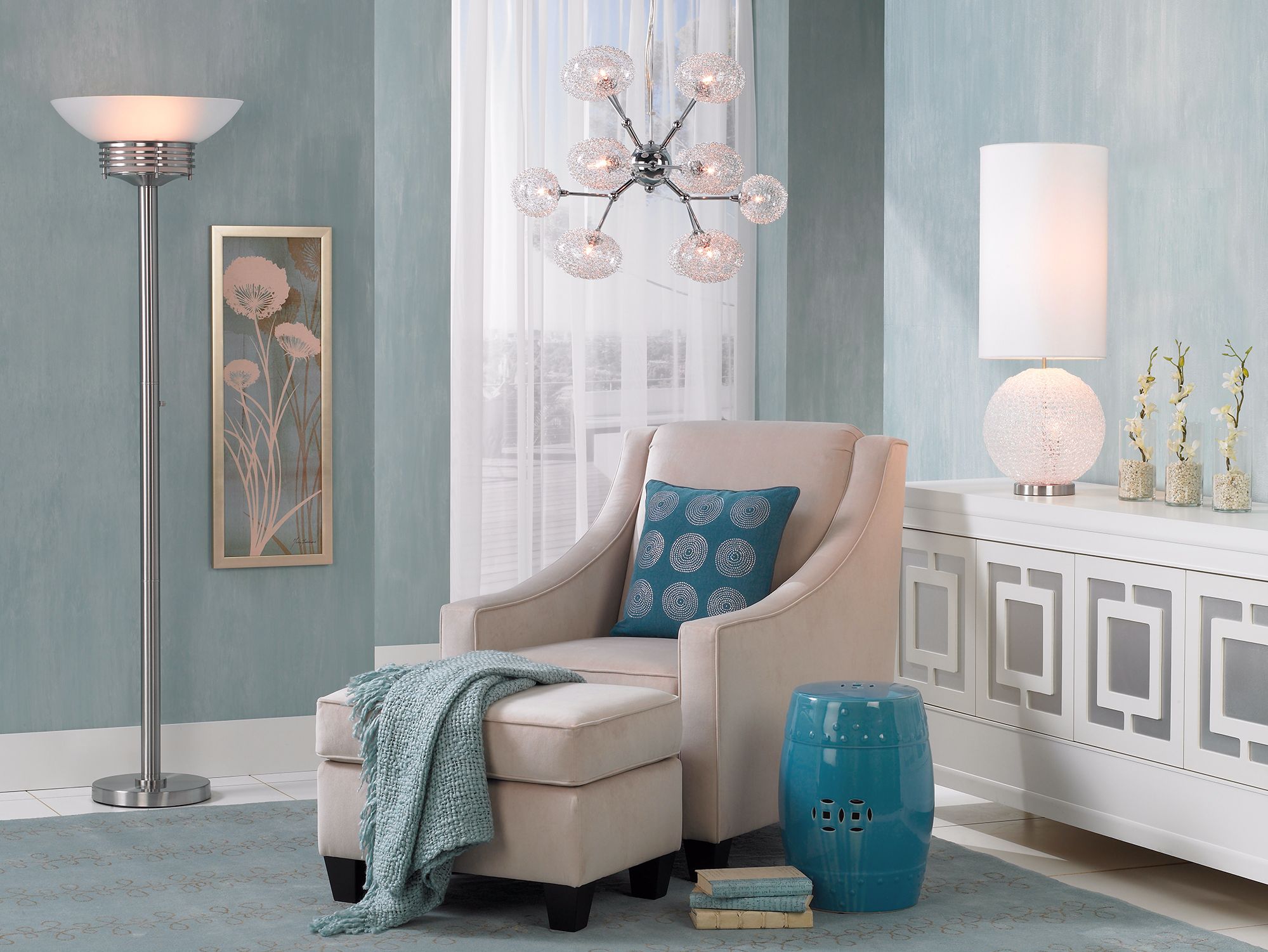 The modern luxe living room balances a few shades of blue and white accents.