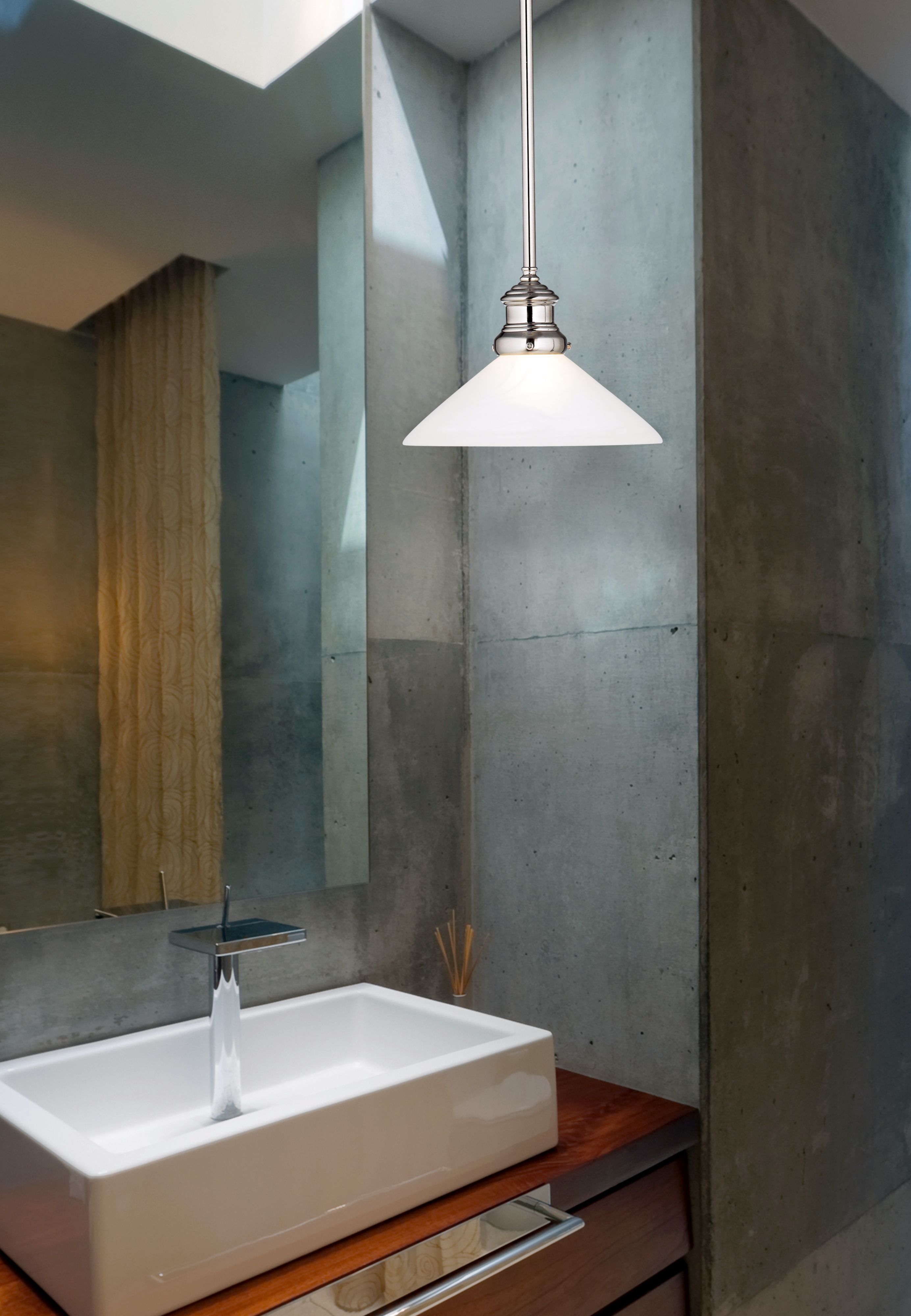 Concrete is a luxurious wall finish in this ultra-contemporary bathroom design.