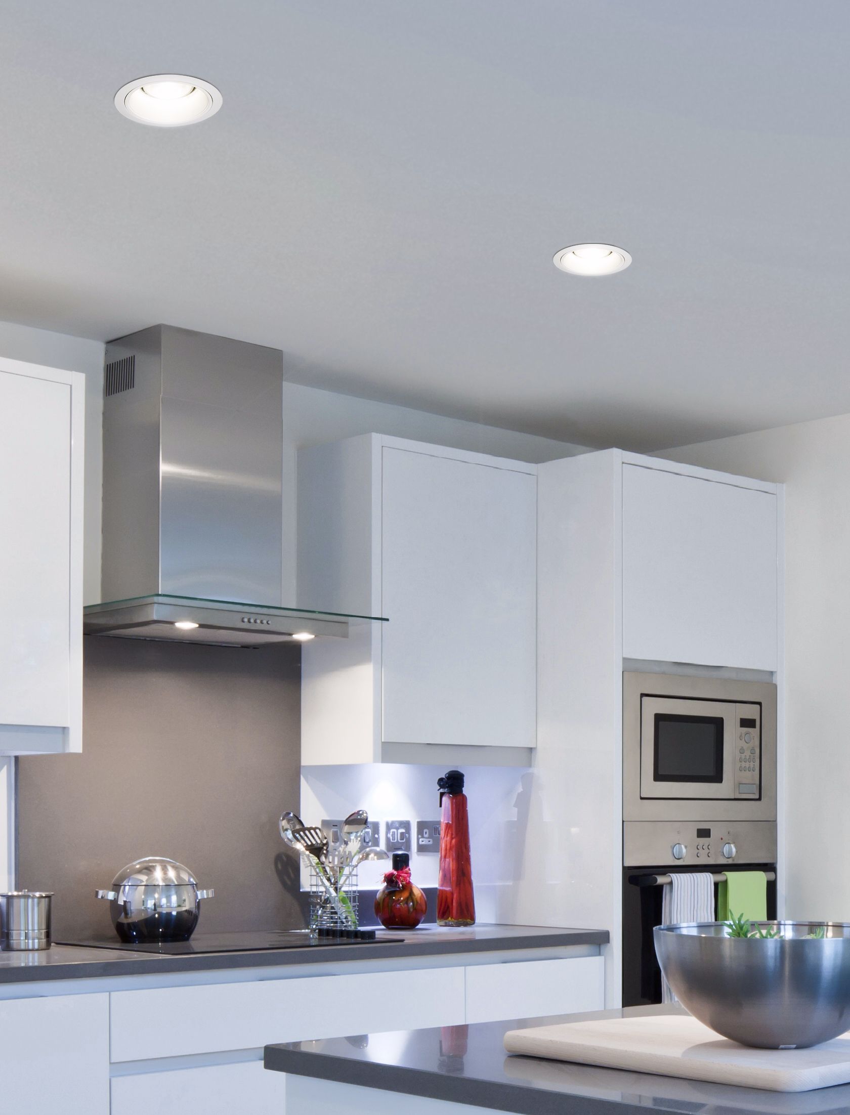 Chic white recessed lights illuminate this contemporary kitchen picture.