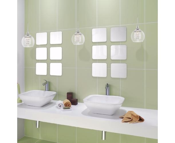 A trio of crystal pendants accents this contemporary bathroom picture