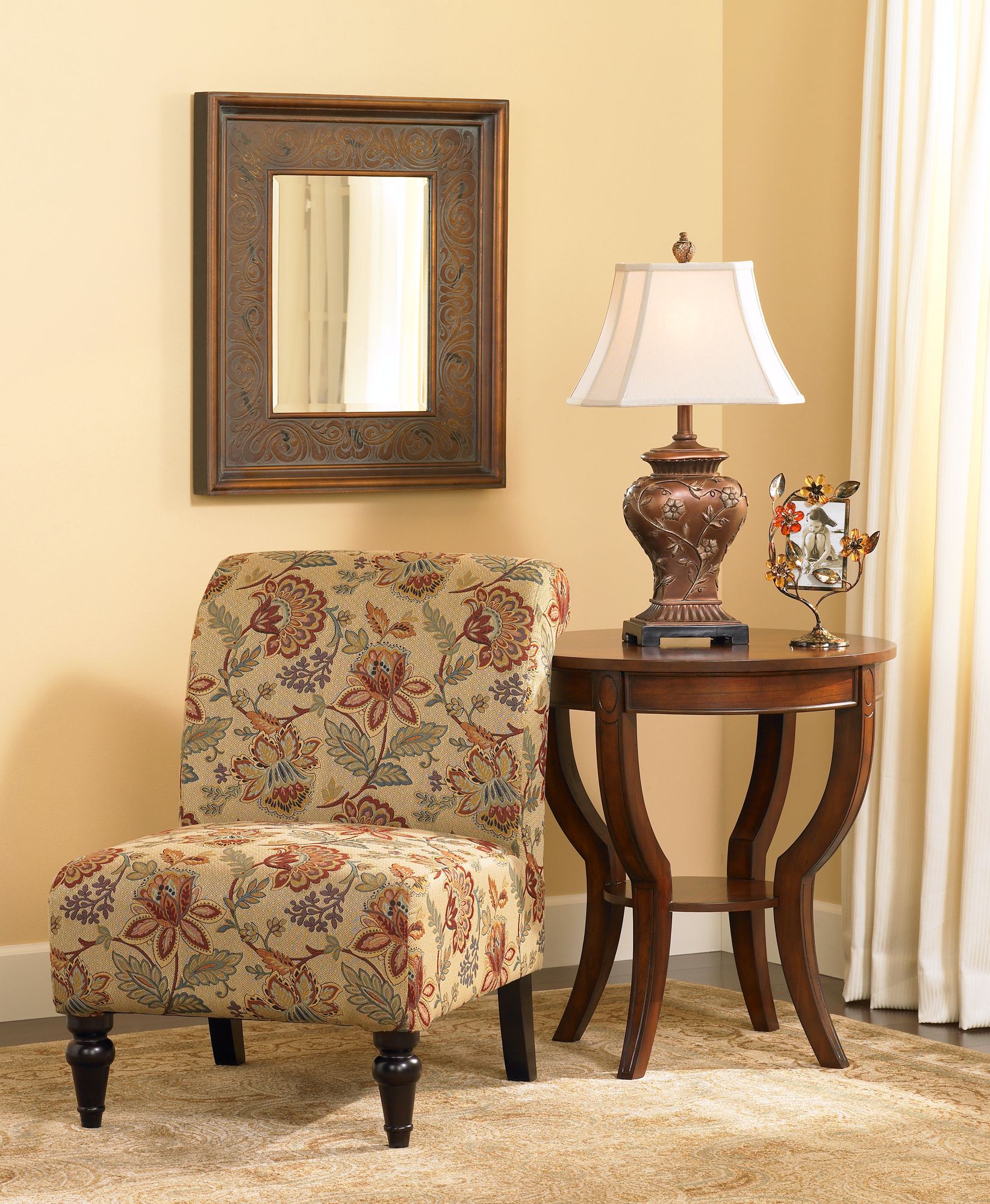 The floral print on the slipper chair creates a traditional aesthetic.