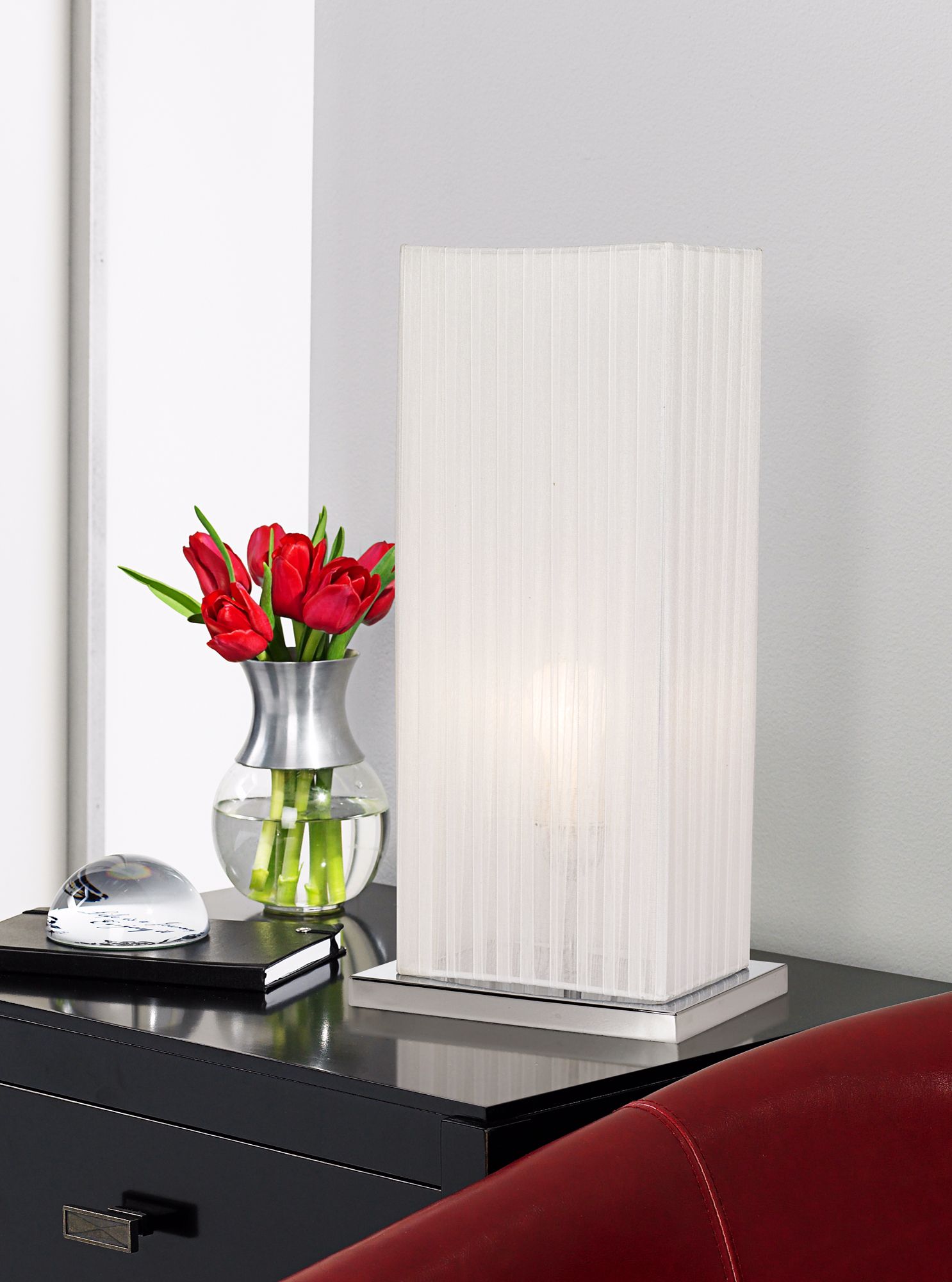 This contemporary column table lamp has a modern, architectural feel.