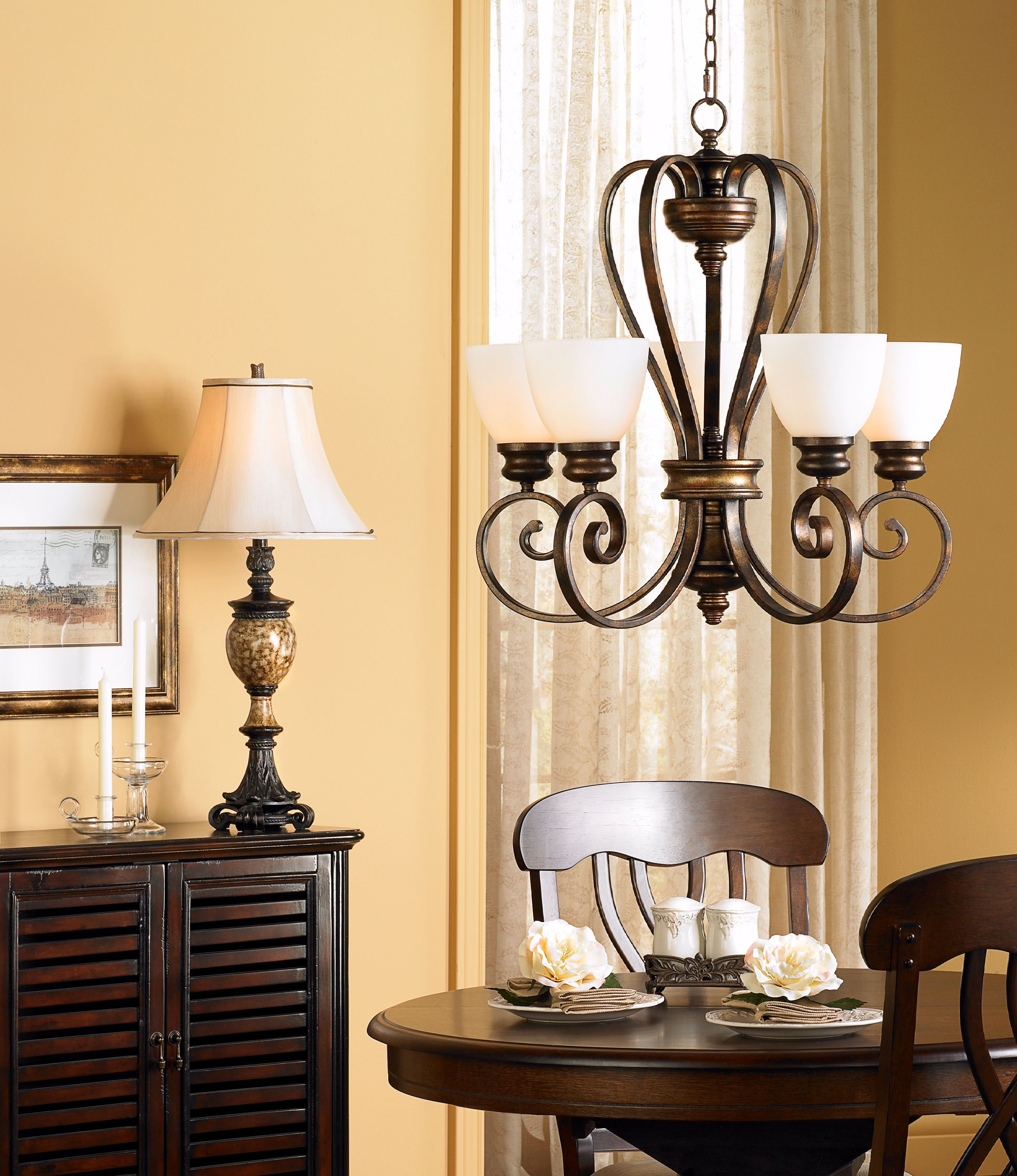The dark wood tones define the old world style of this dining room scene.