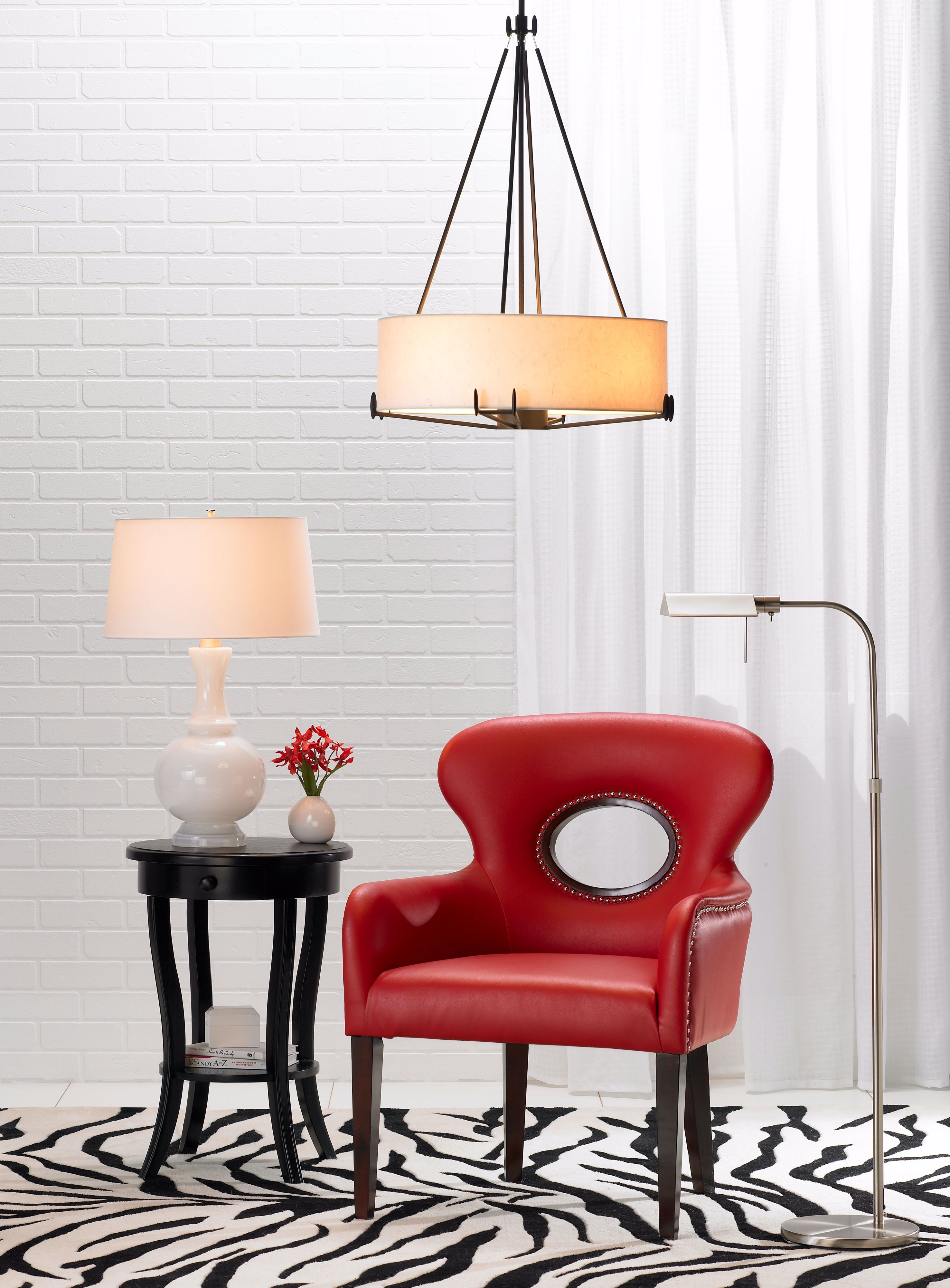 Revisit the retro era with the Odeon red faux leather with nails accent chair.