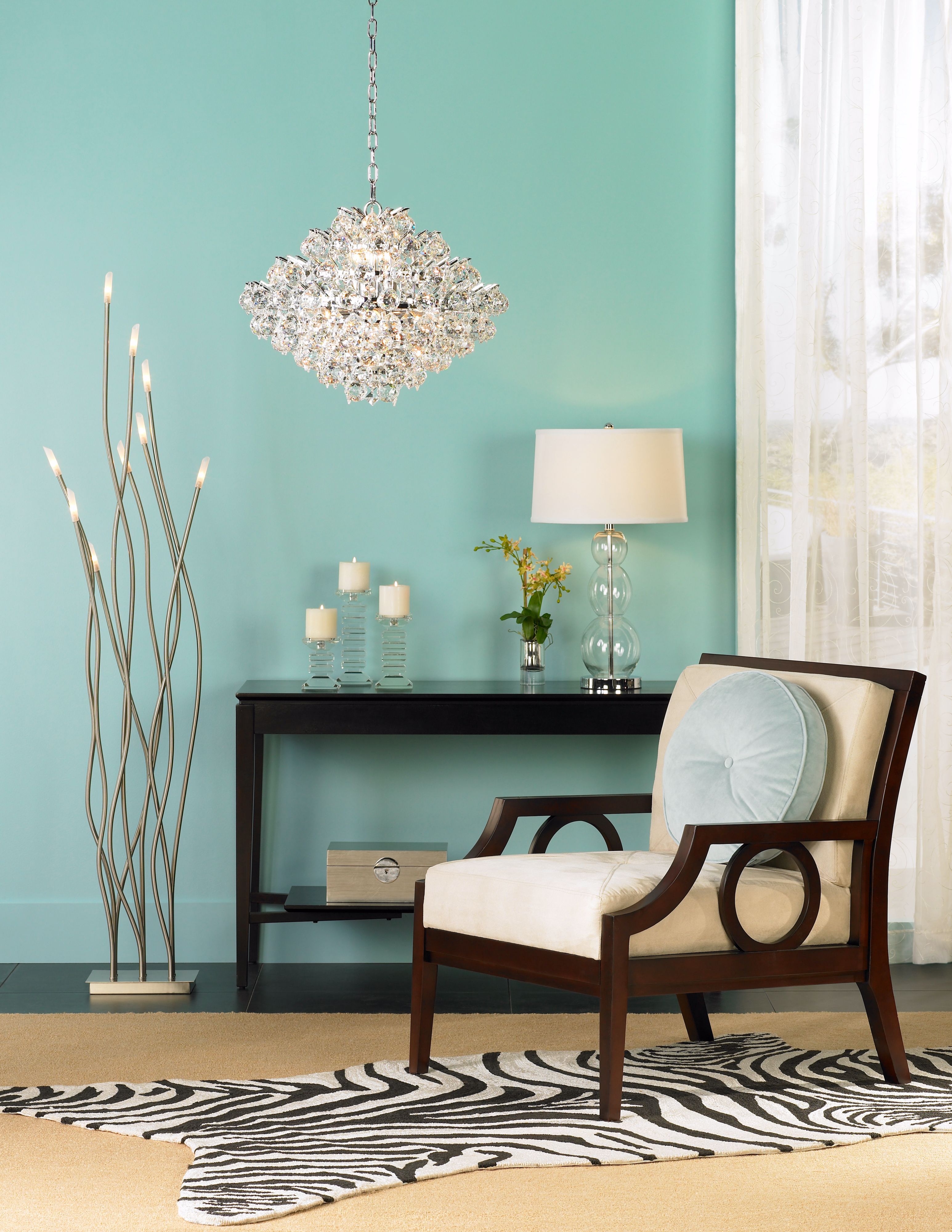 The Vienna chrome and crystal chandelier adds glamour to the room scene.