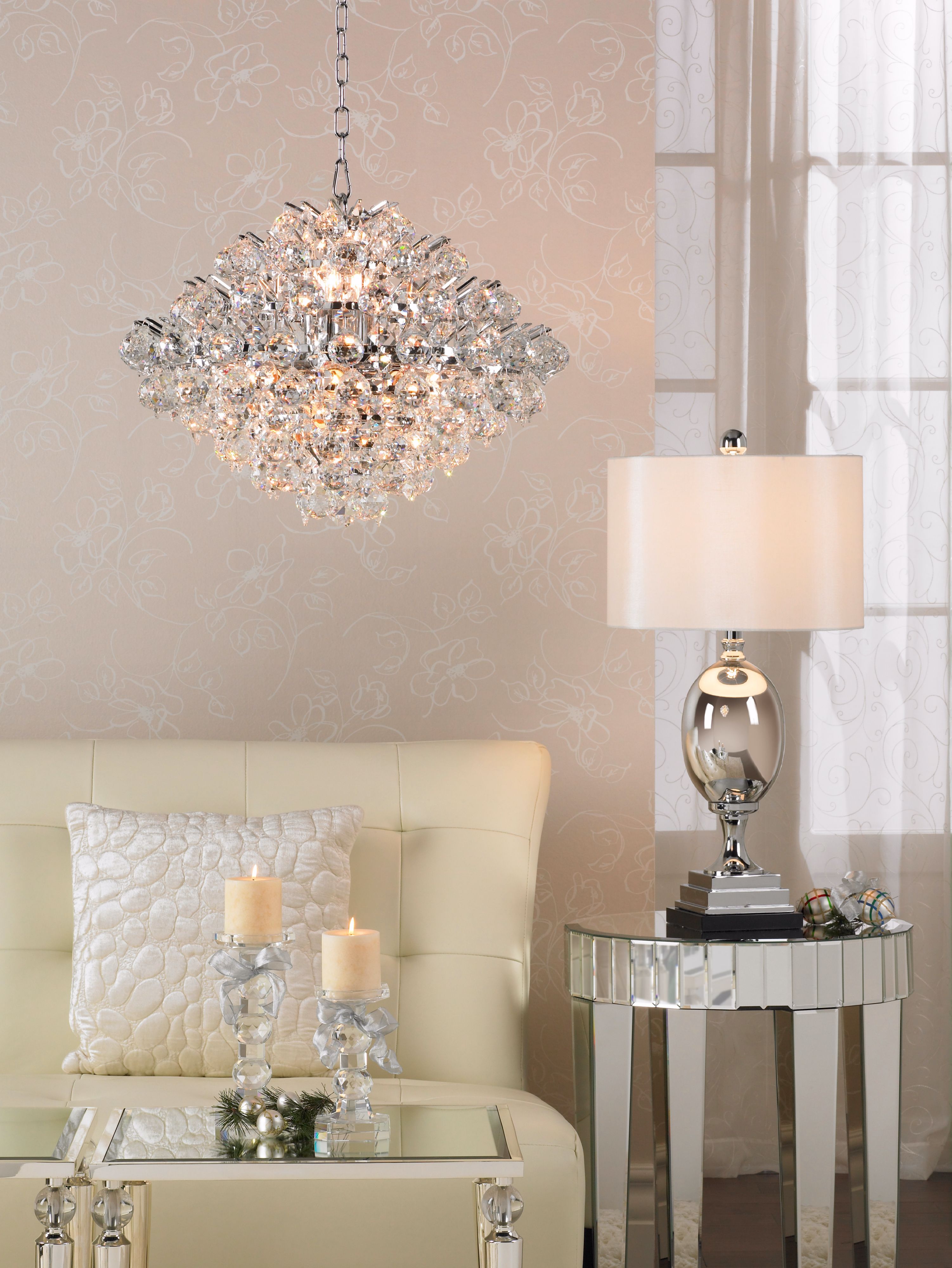 Using mirrored finishes is a beautiful transitional living room design idea.