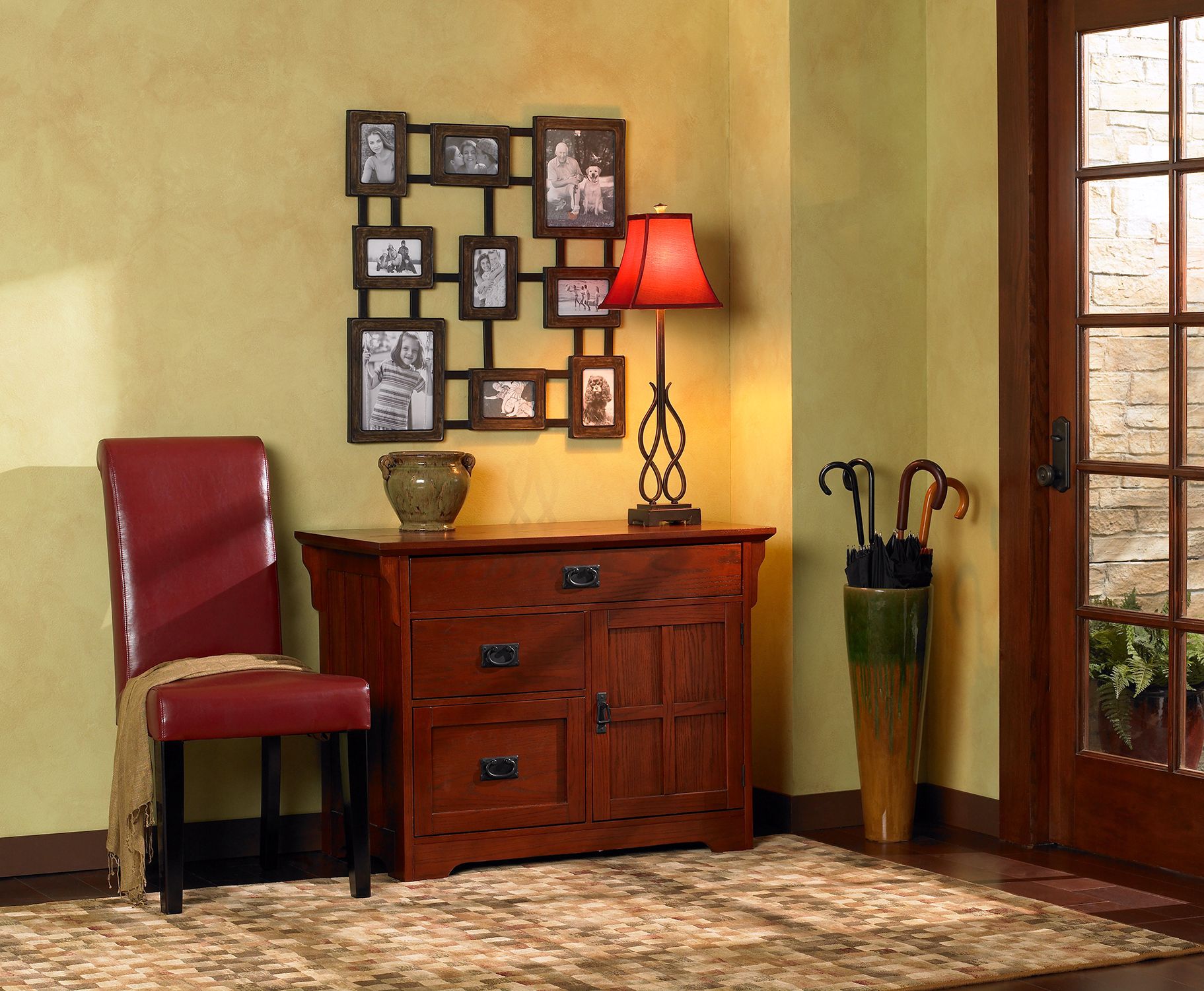A transitional entryway - lighting, furniture styles and periods are mixed.