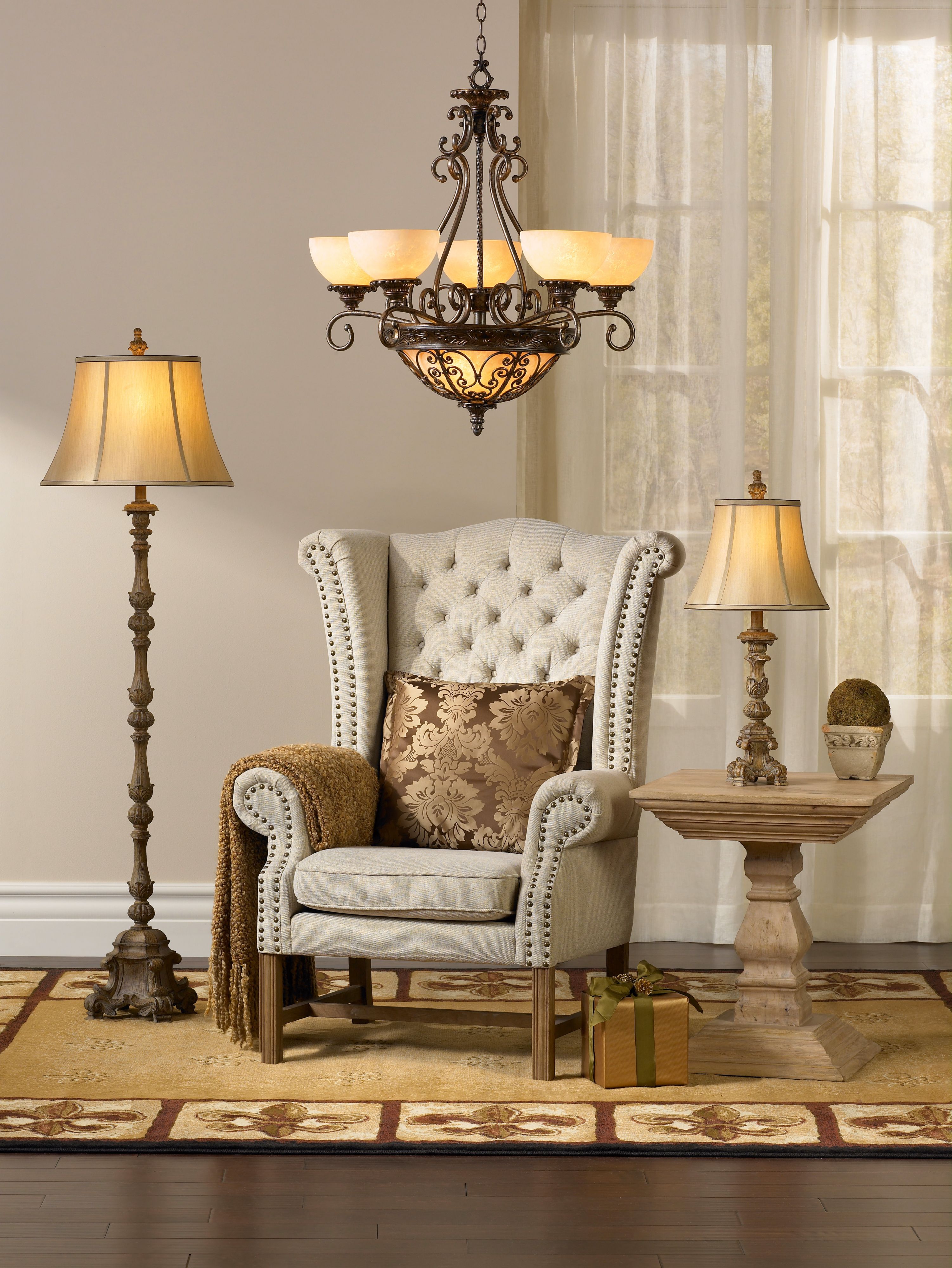 Layering home lighting creates a warm and rich feel in this living room design.