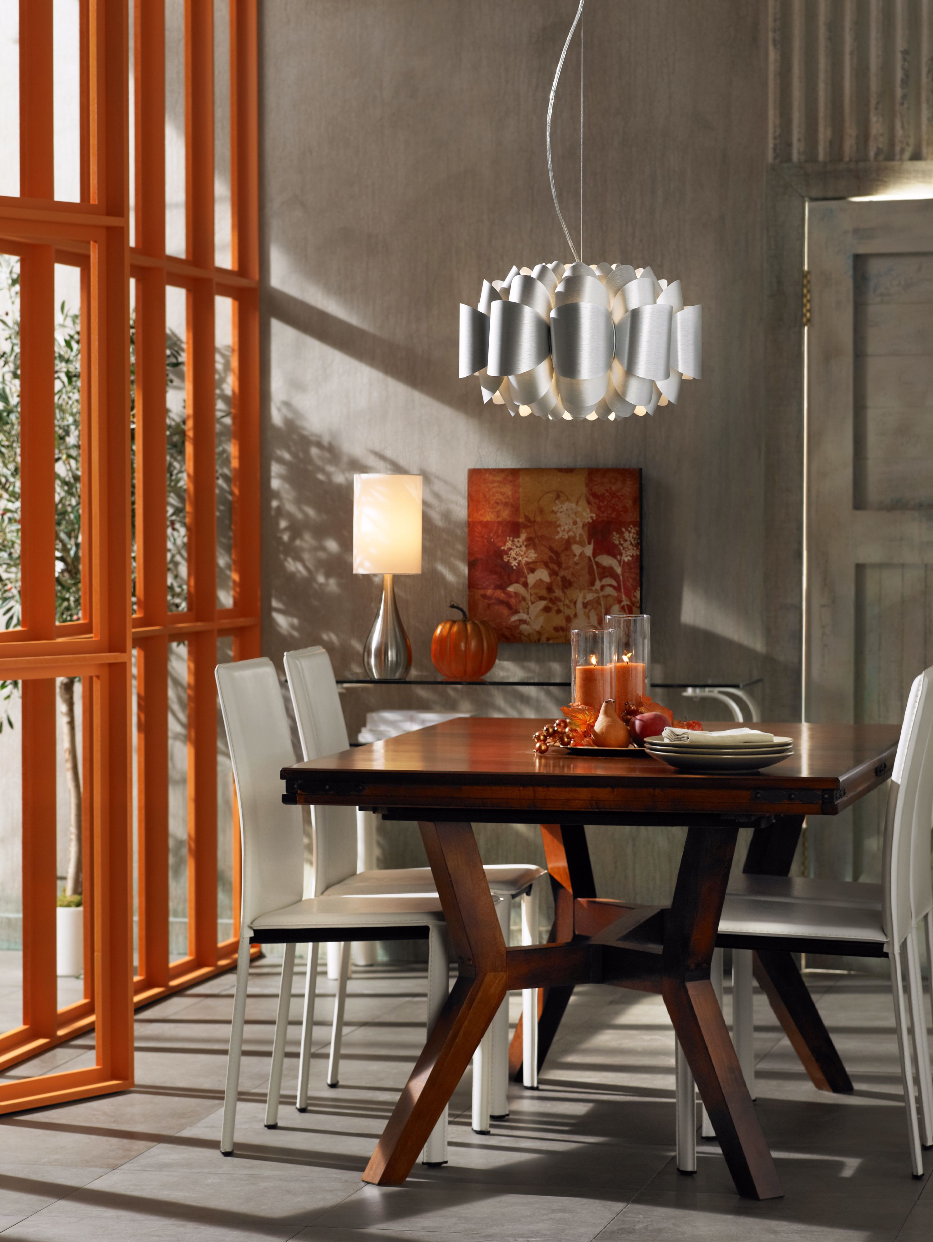 A City Chic dining room decorating idea with a contemporary chandelier.