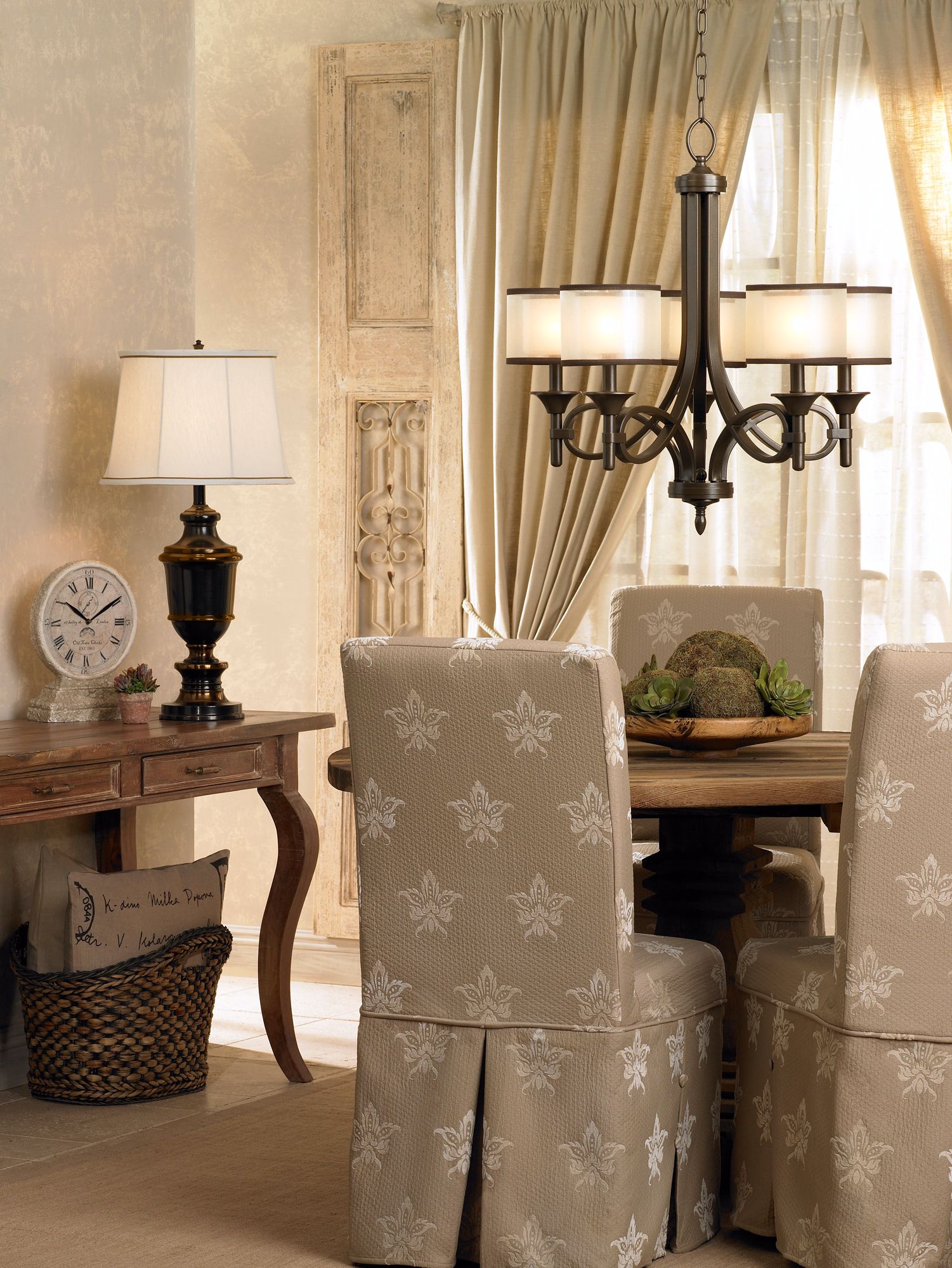 The weathered woods and bronze finish fixtures create a French chic aesthetic.