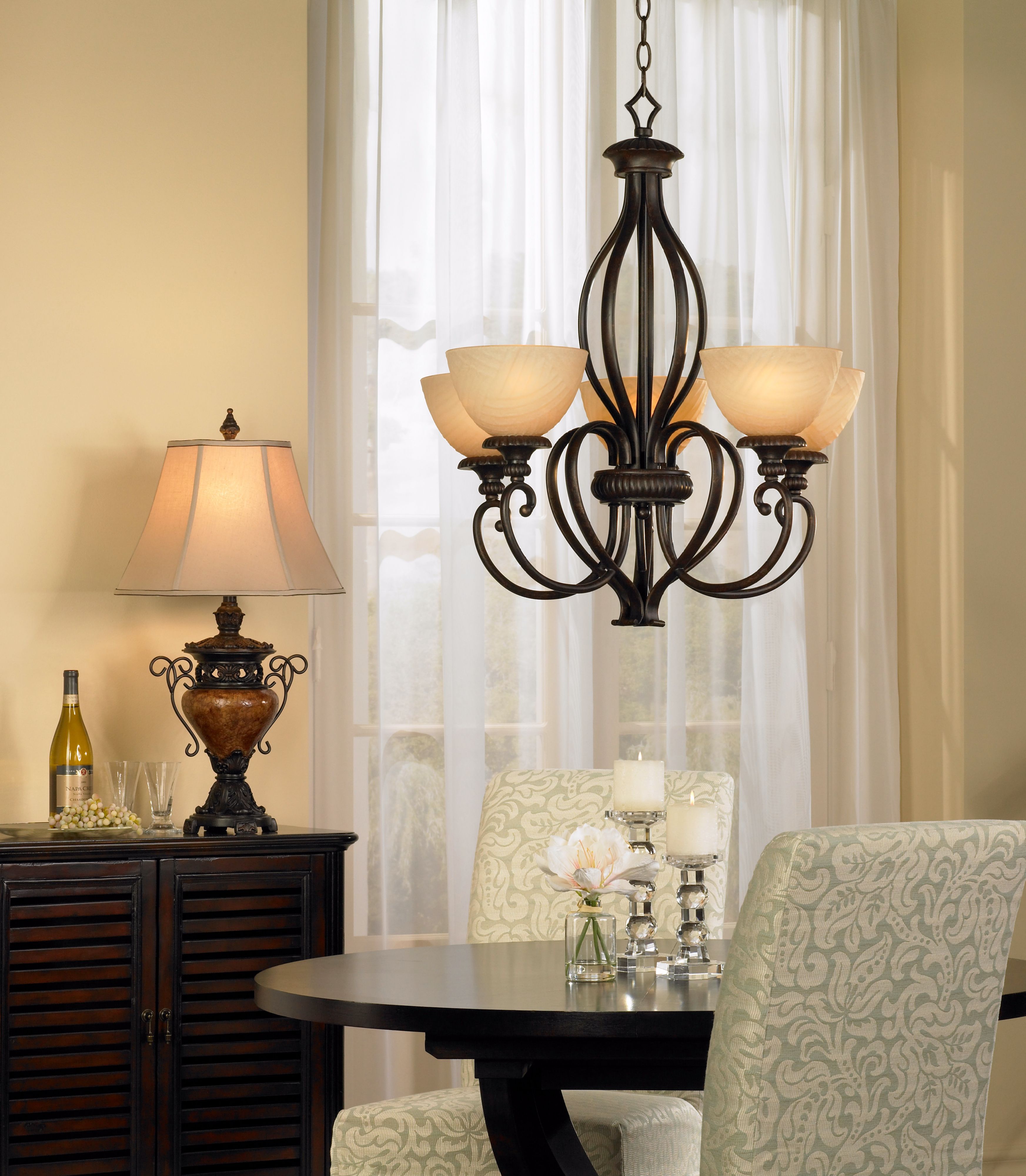 Decorating ideas for this dining room include ornate traditional lighting.
