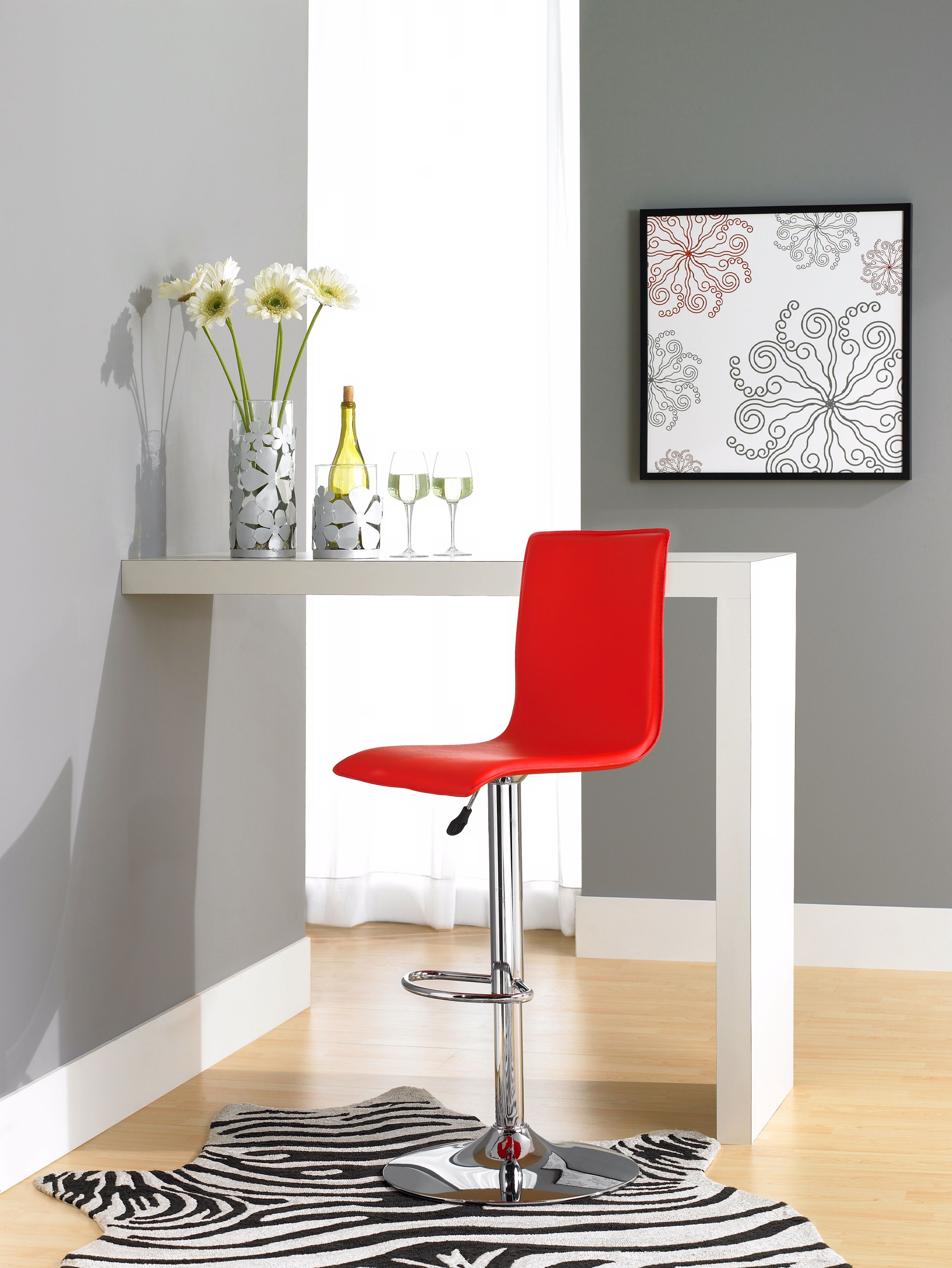 A red bar stool adds a burst of color in this modern dining room!