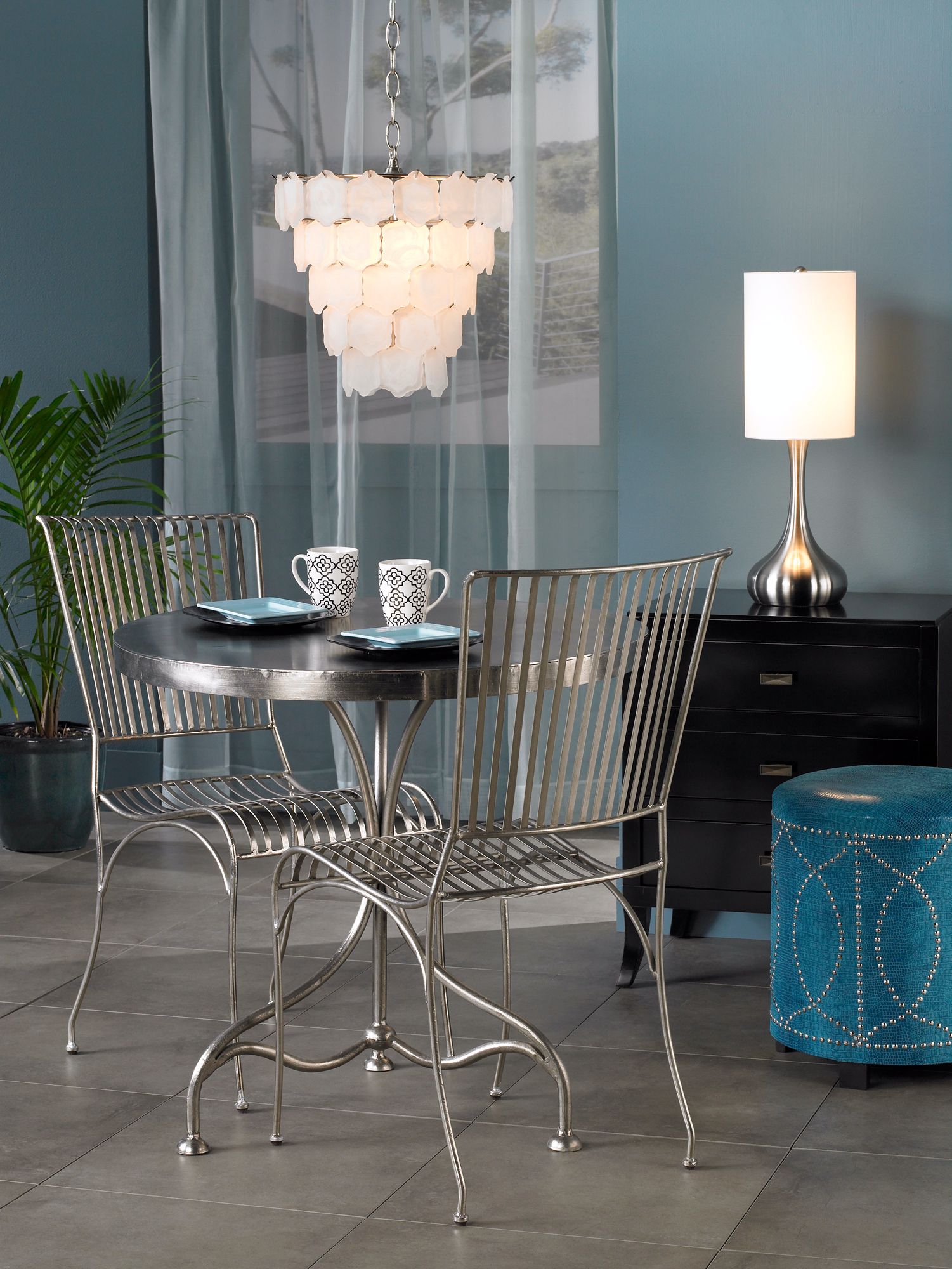The chrome finish table and chairs set the tone for a modern space.