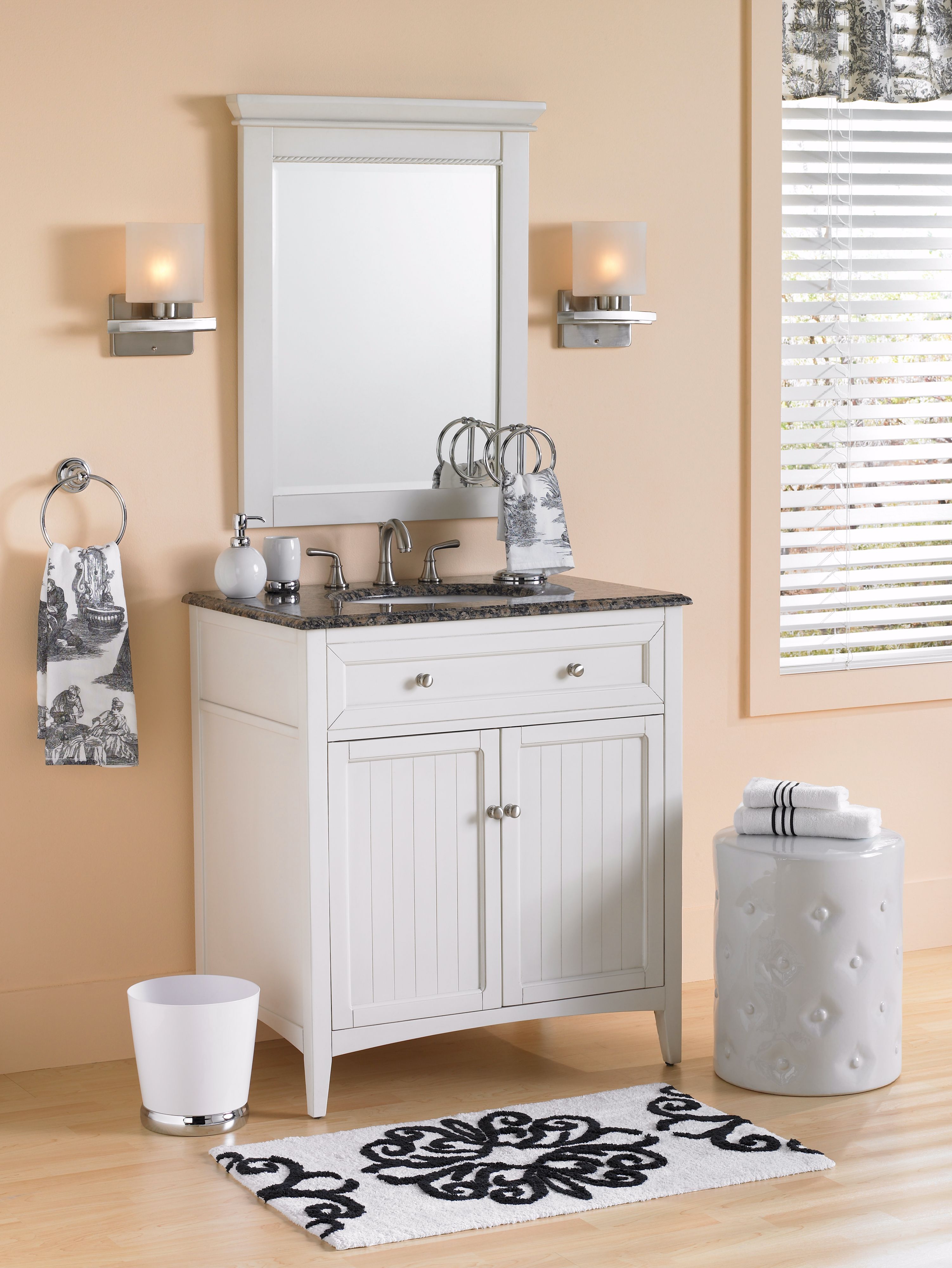 Soft colors and rustic furniture make a sweet country cottage bathroom retreat.