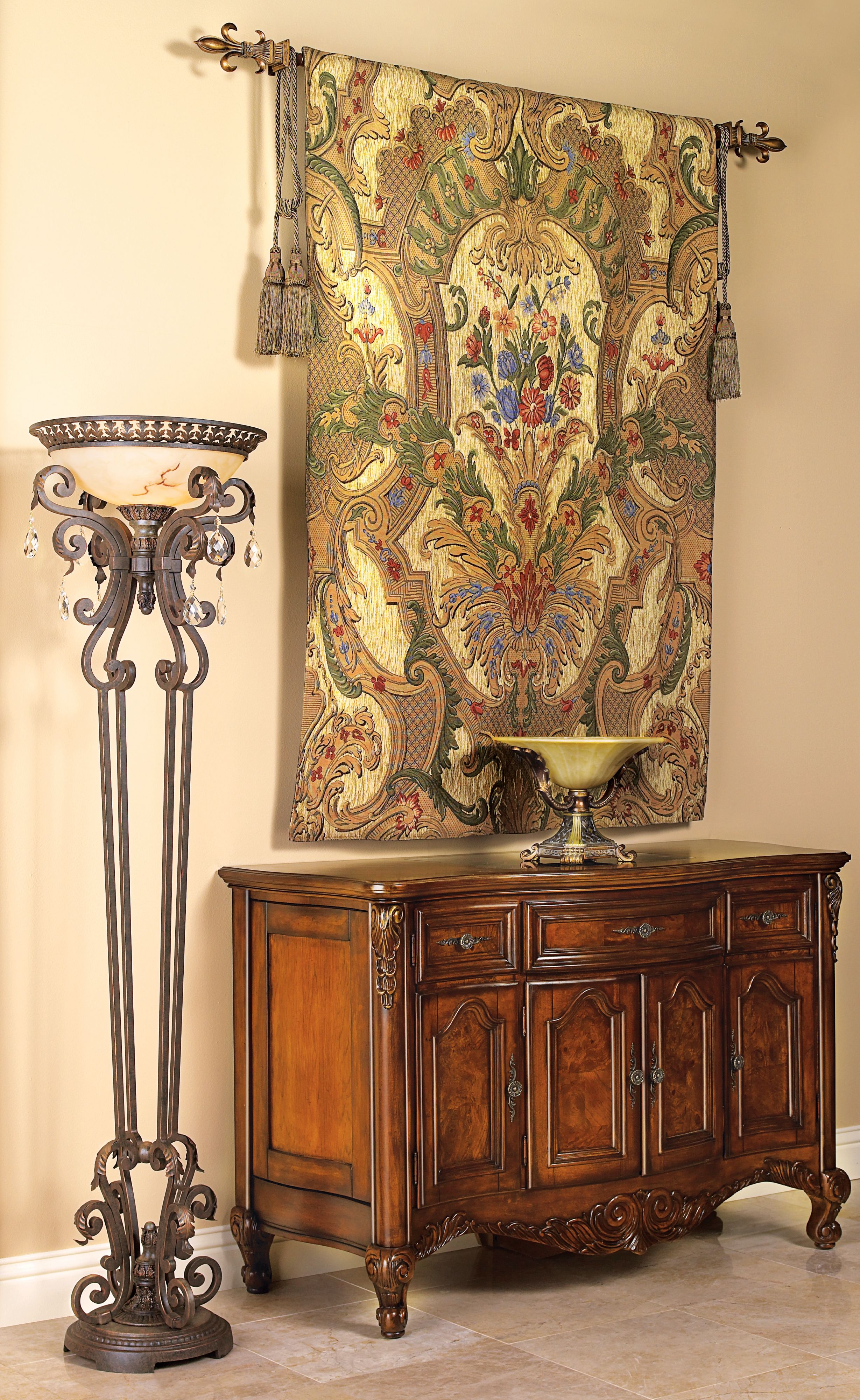 The gold and beige wall tapestry is the statement piece in the entryway design.
