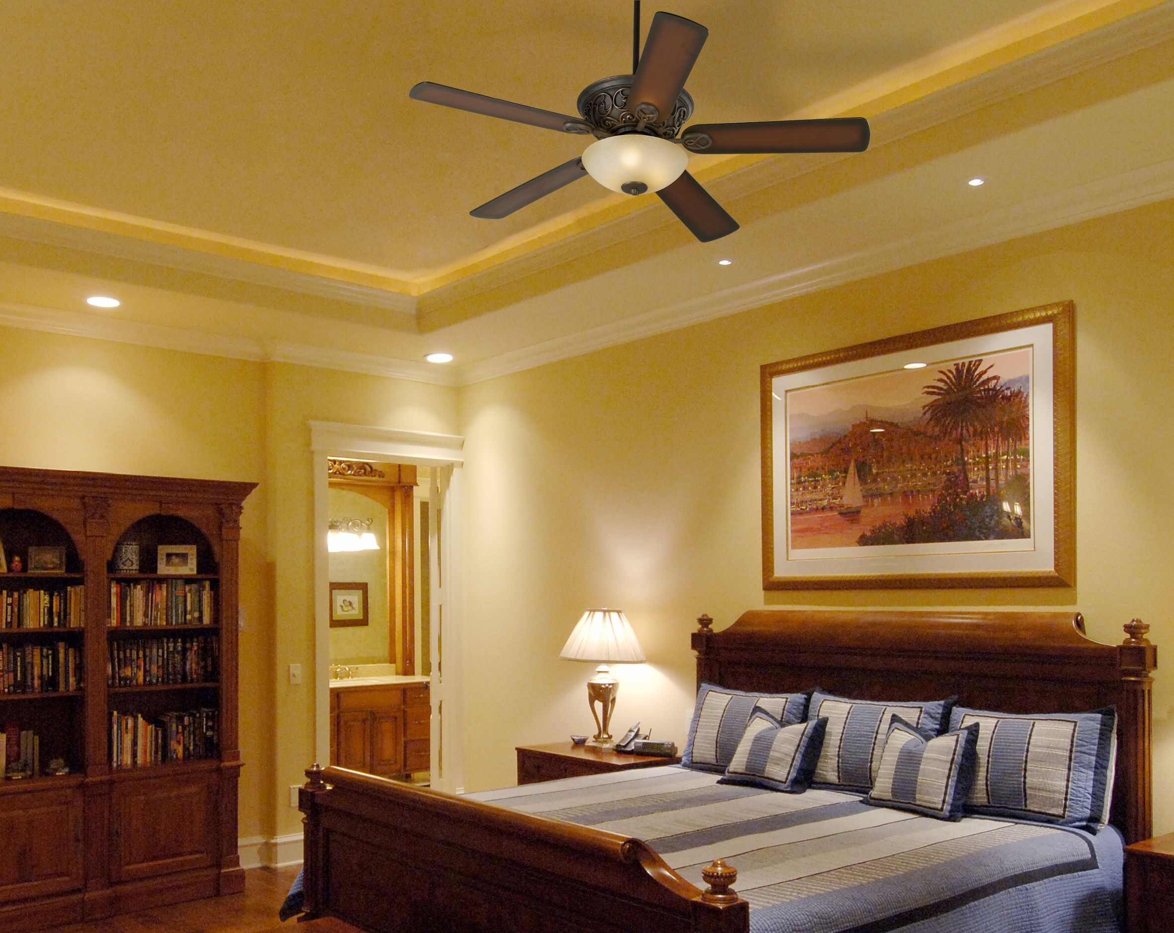 A sleigh bed is the focus in this traditional master bedroom design picture.