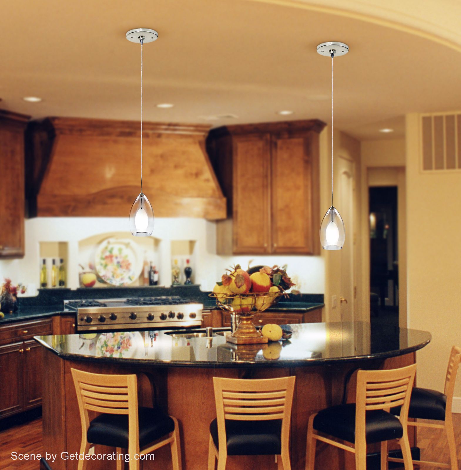 Sleek glass pendants add style to this contemporary kitchen picture.
