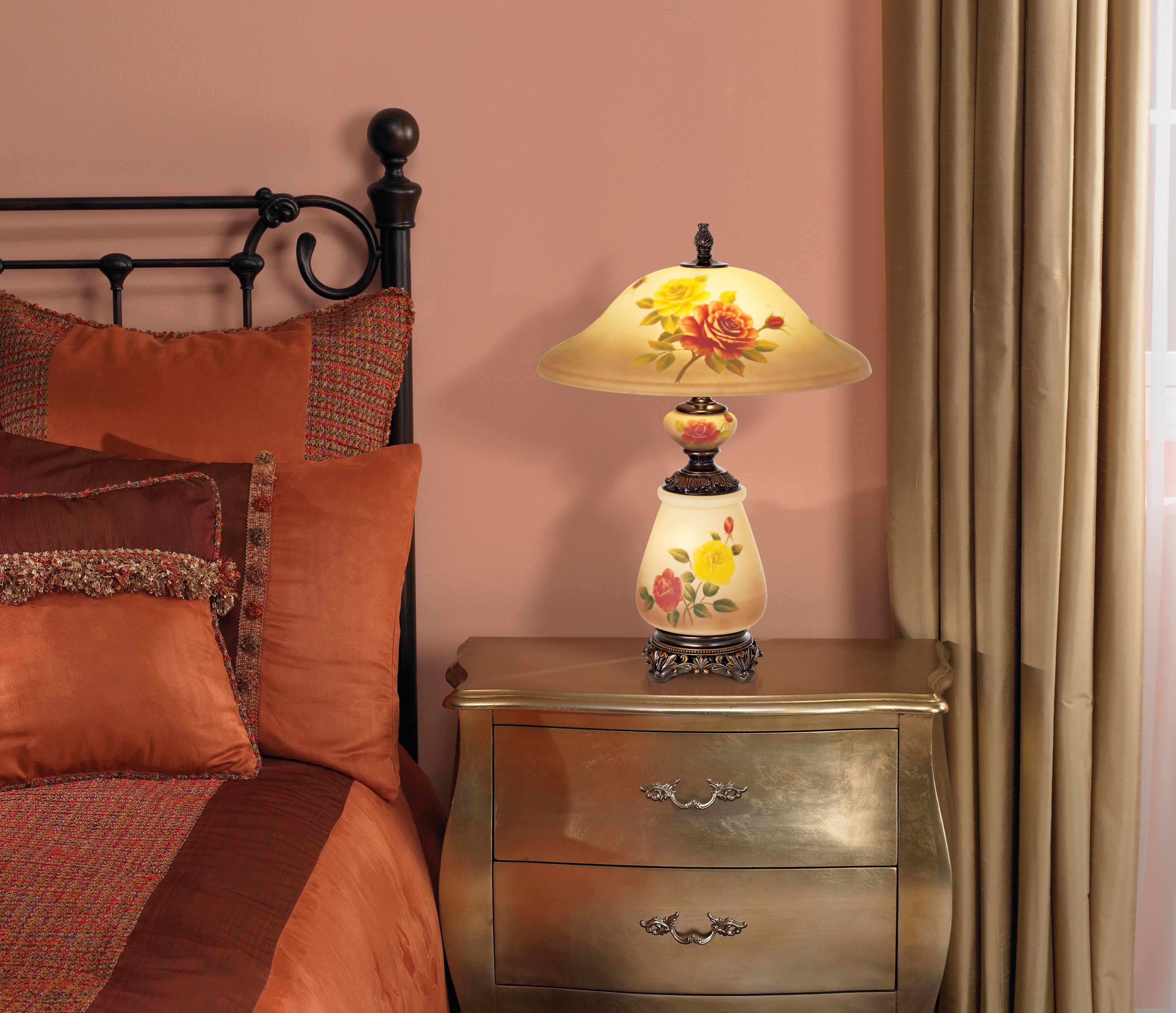 Accent a traditional country cottage bedroom with a pretty floral lamp.