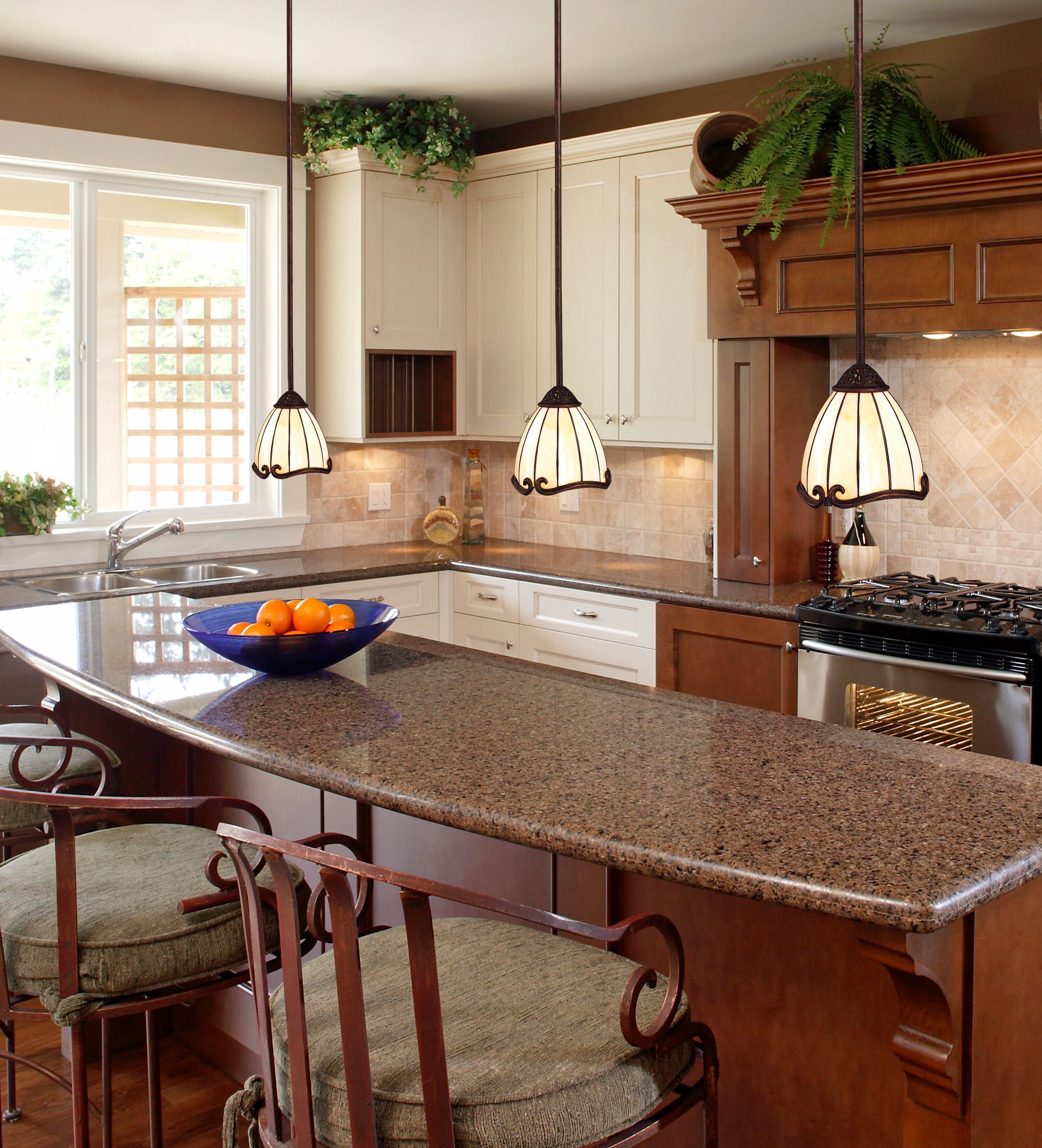 Art Nouveau style pendant chandeliers make this traditional kitchen Trad Chic.