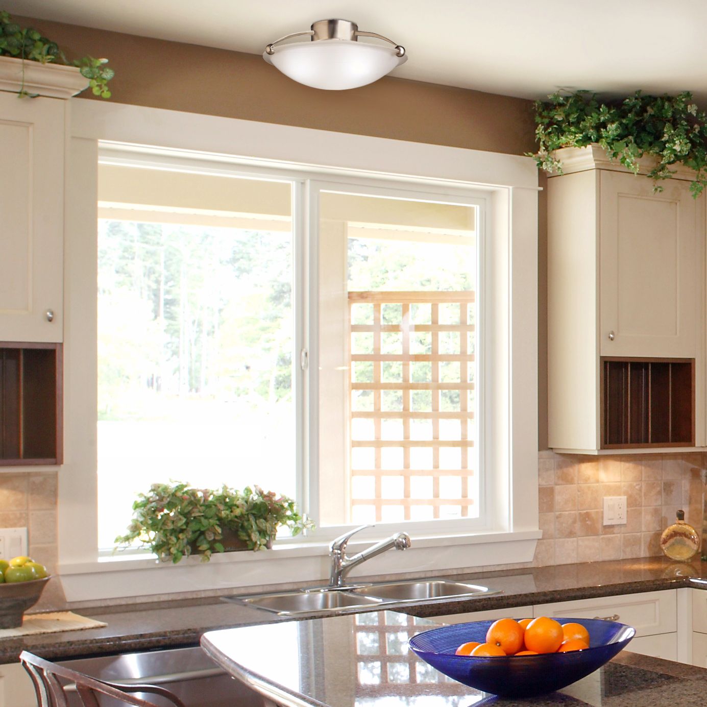 Keep it simple in a contemporary kitchen design with a minimalist light fixture.