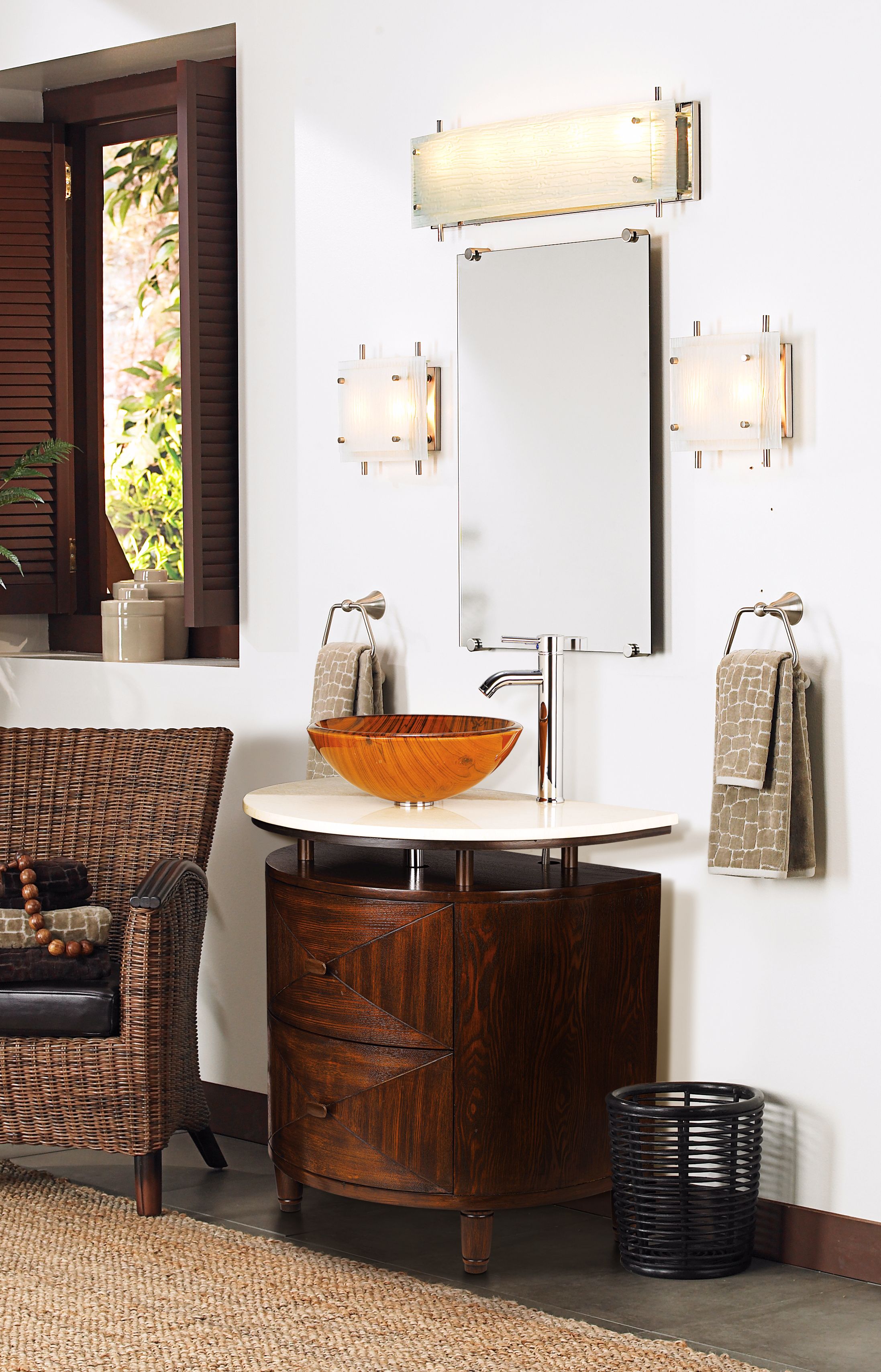 A contemporary bathroom vessel sink in colorful orange.