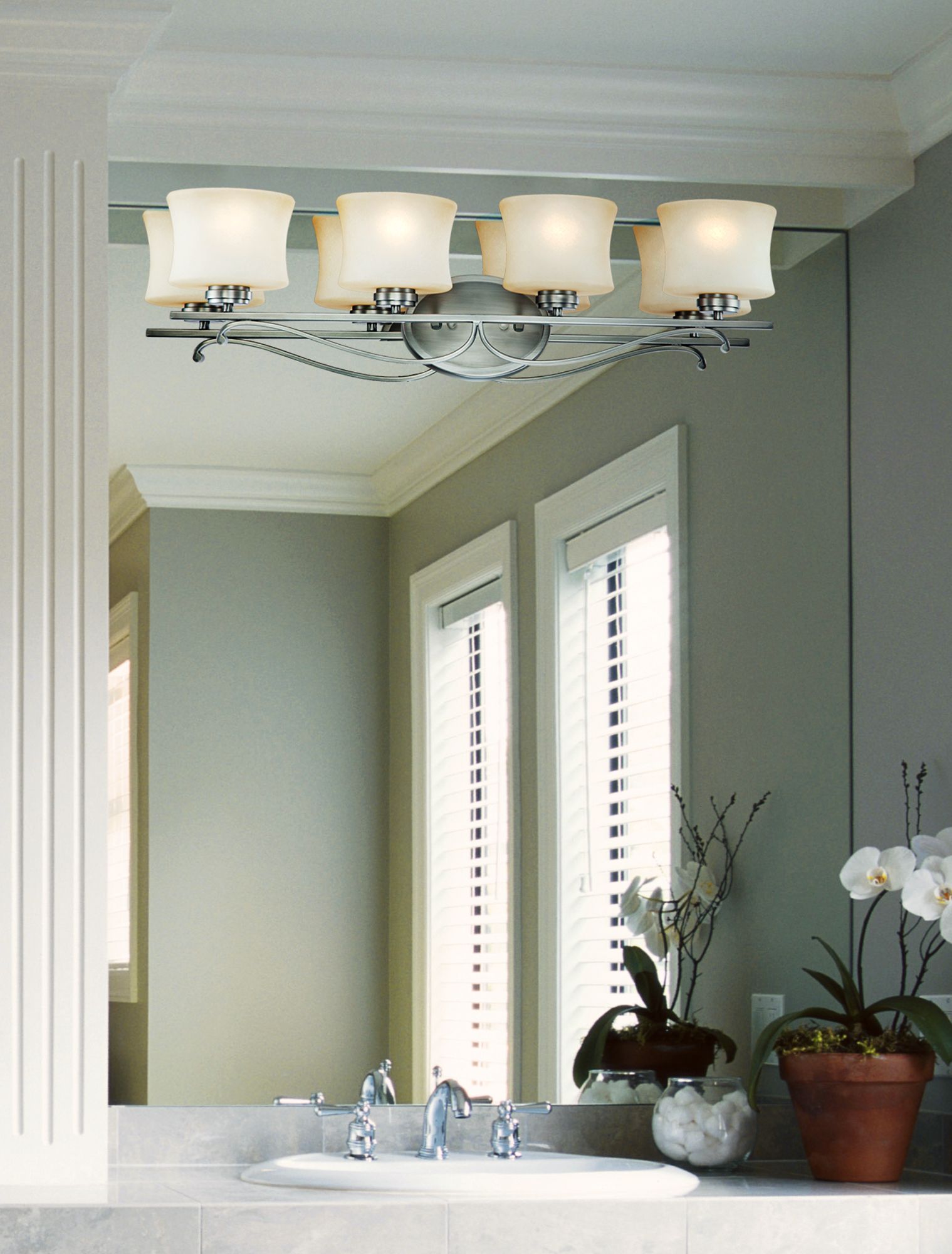 Mounting a light fixture directly on the mirror is a great use of a small space!