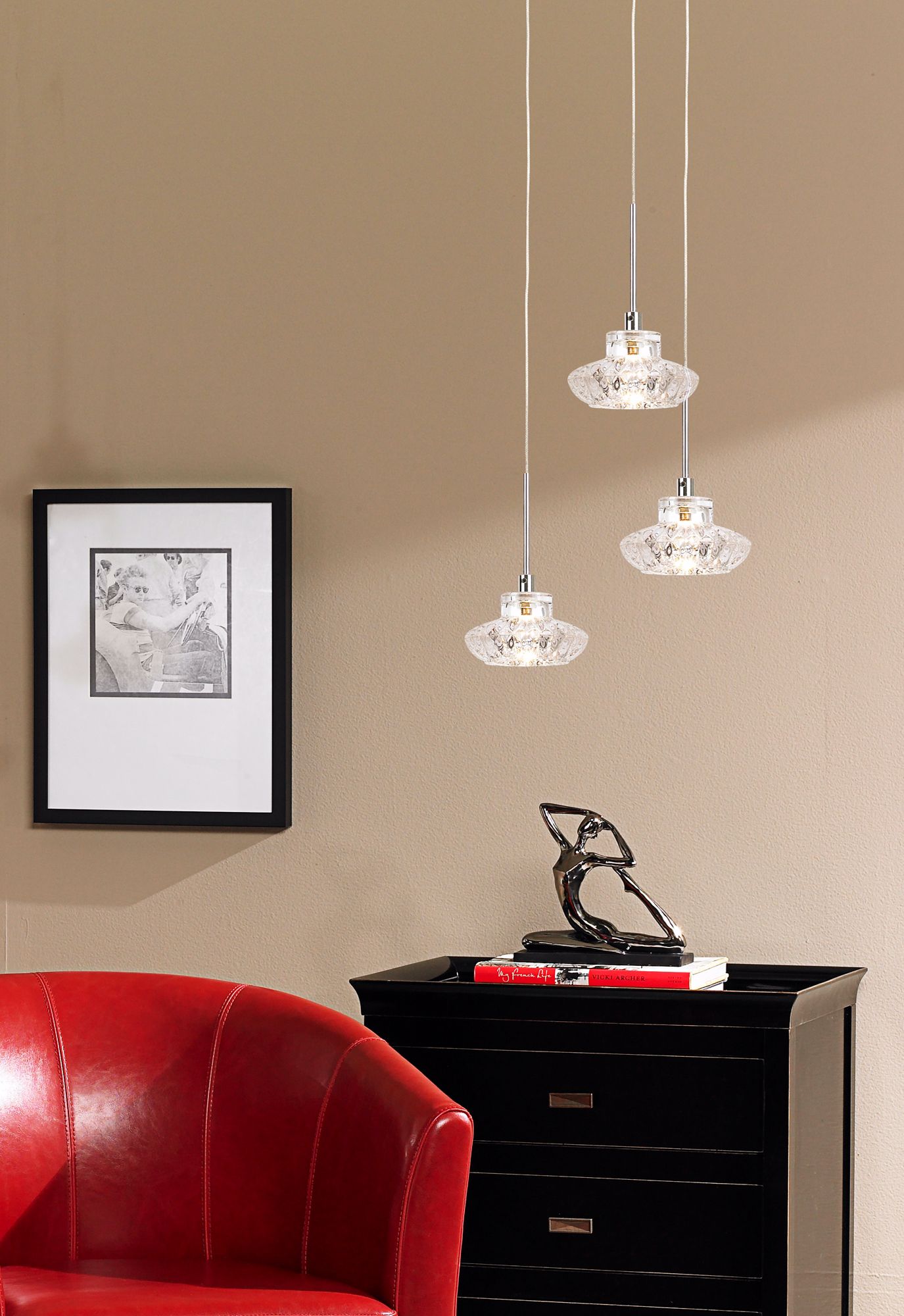 A trio of glass pendants makes a shining statement in this living room picture.
