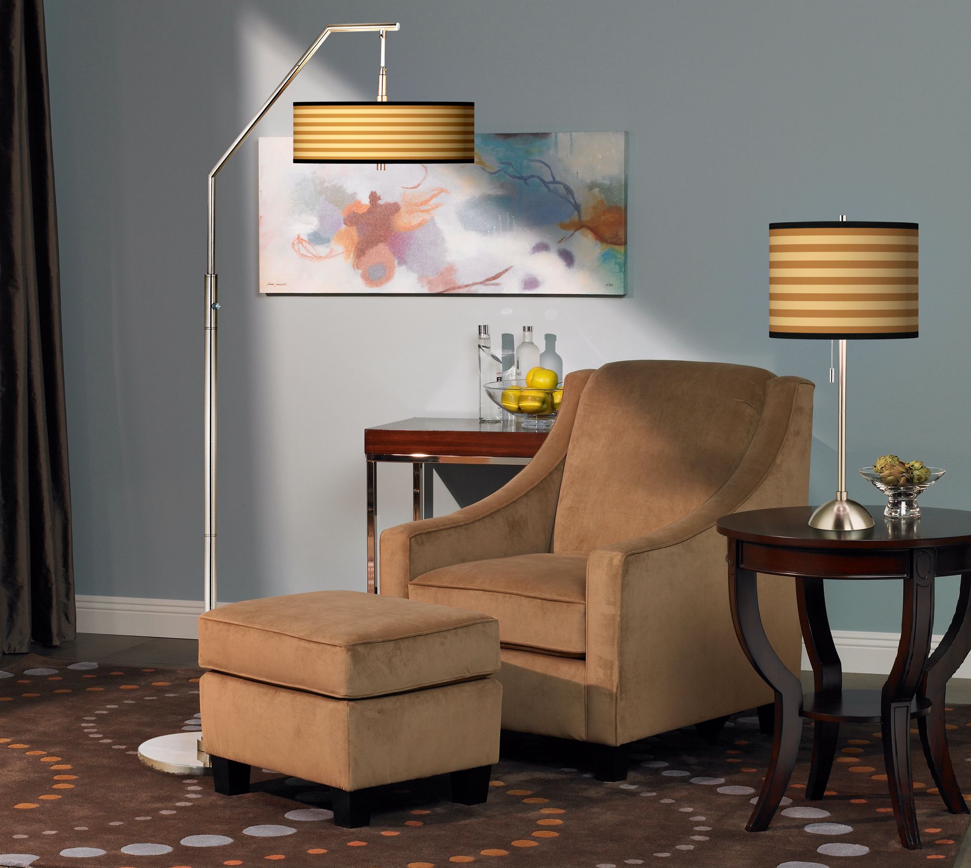 The combination of the arc floor lamp and table lamp creates a dynamic space.