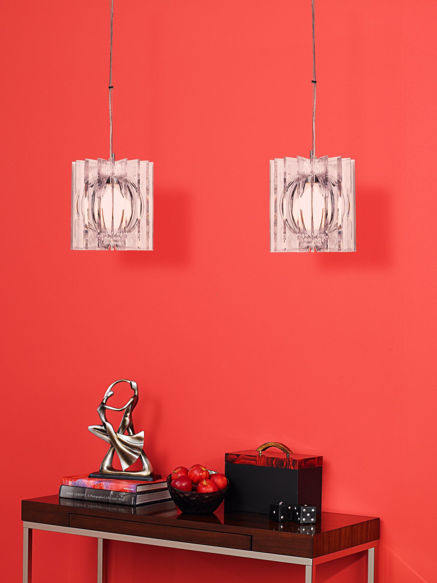 A pair of pendant lights makes a statement in a contemporary hallway design.