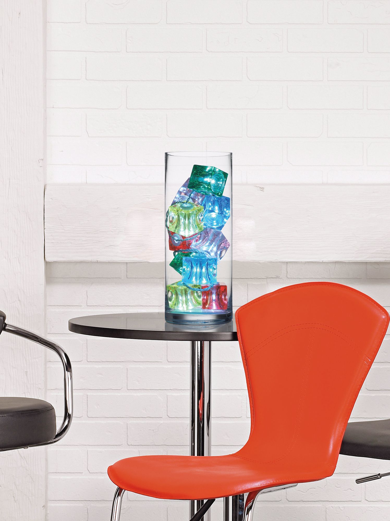 10 Colored Ice Cube LED Lights in Clear Vase in scene