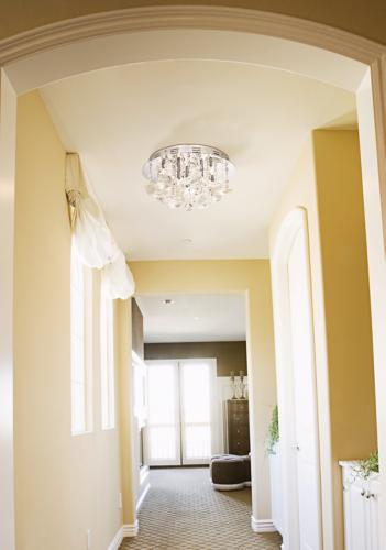 Sunny yellow paint livens up a plain hallway. - Lighting & Decor