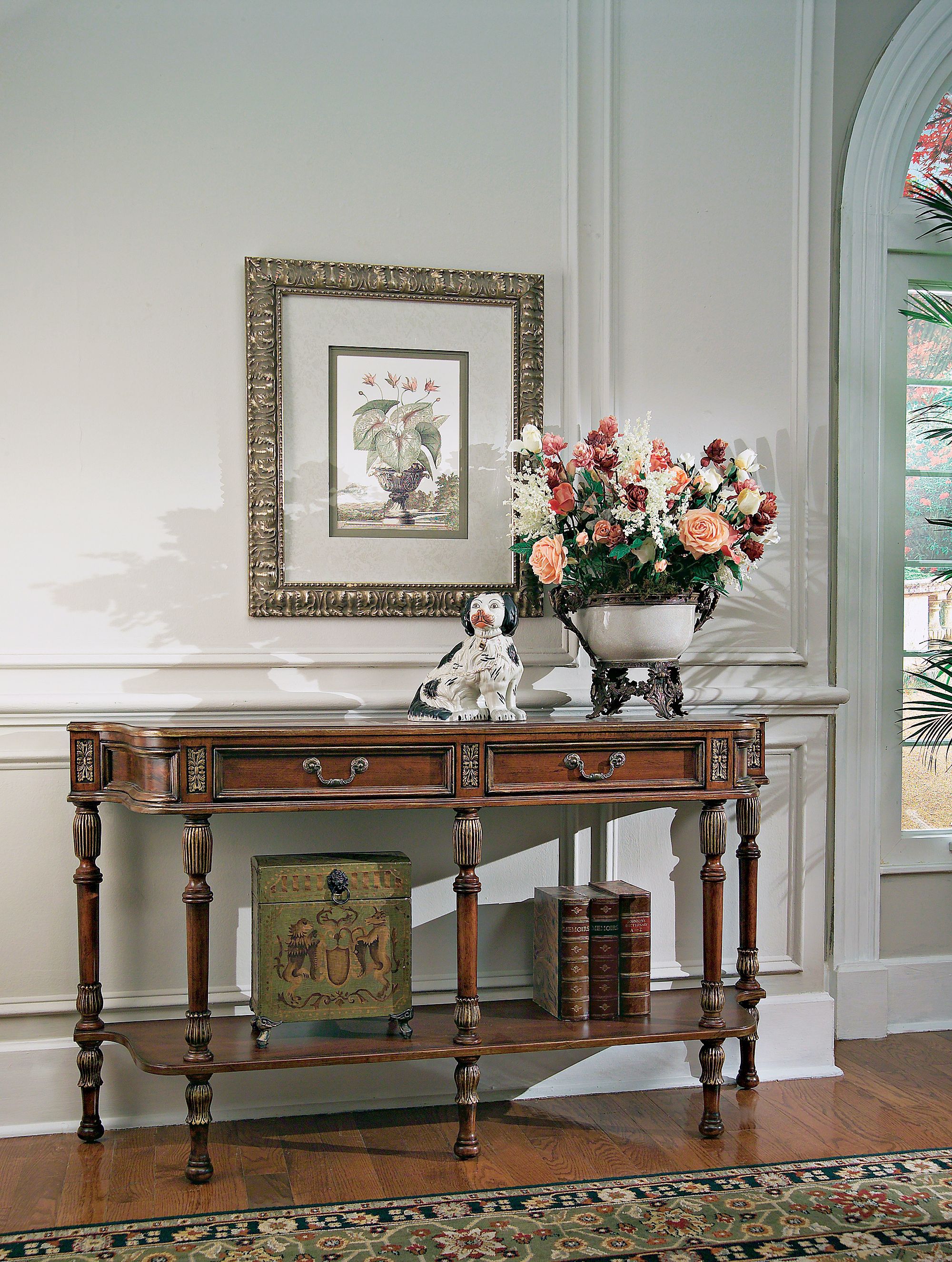 A hallway console offers display space and storage space to control clutter.