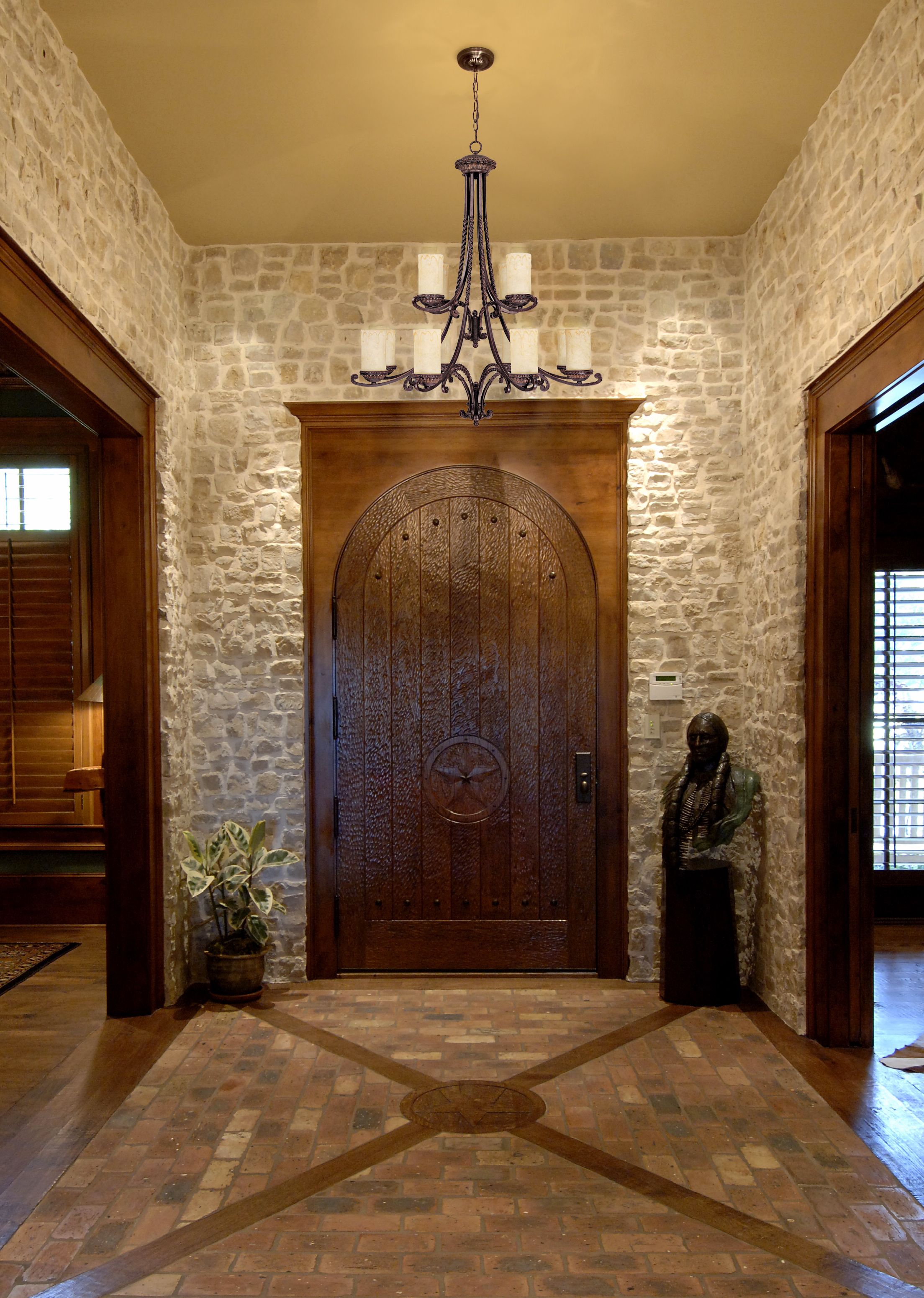 Natural stone and rich woods create a dignified first impression in an entry.