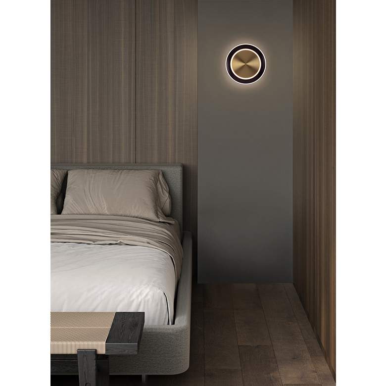 Image 1 Saturn 9 3/4"H Antique Brass and Black Bonze LED Wall Sconce in scene