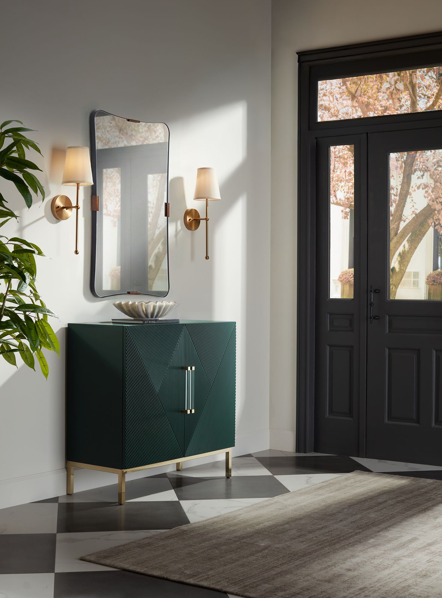 Uttermost Saranac 24x38 Black and Brass Wall Mirror in scene