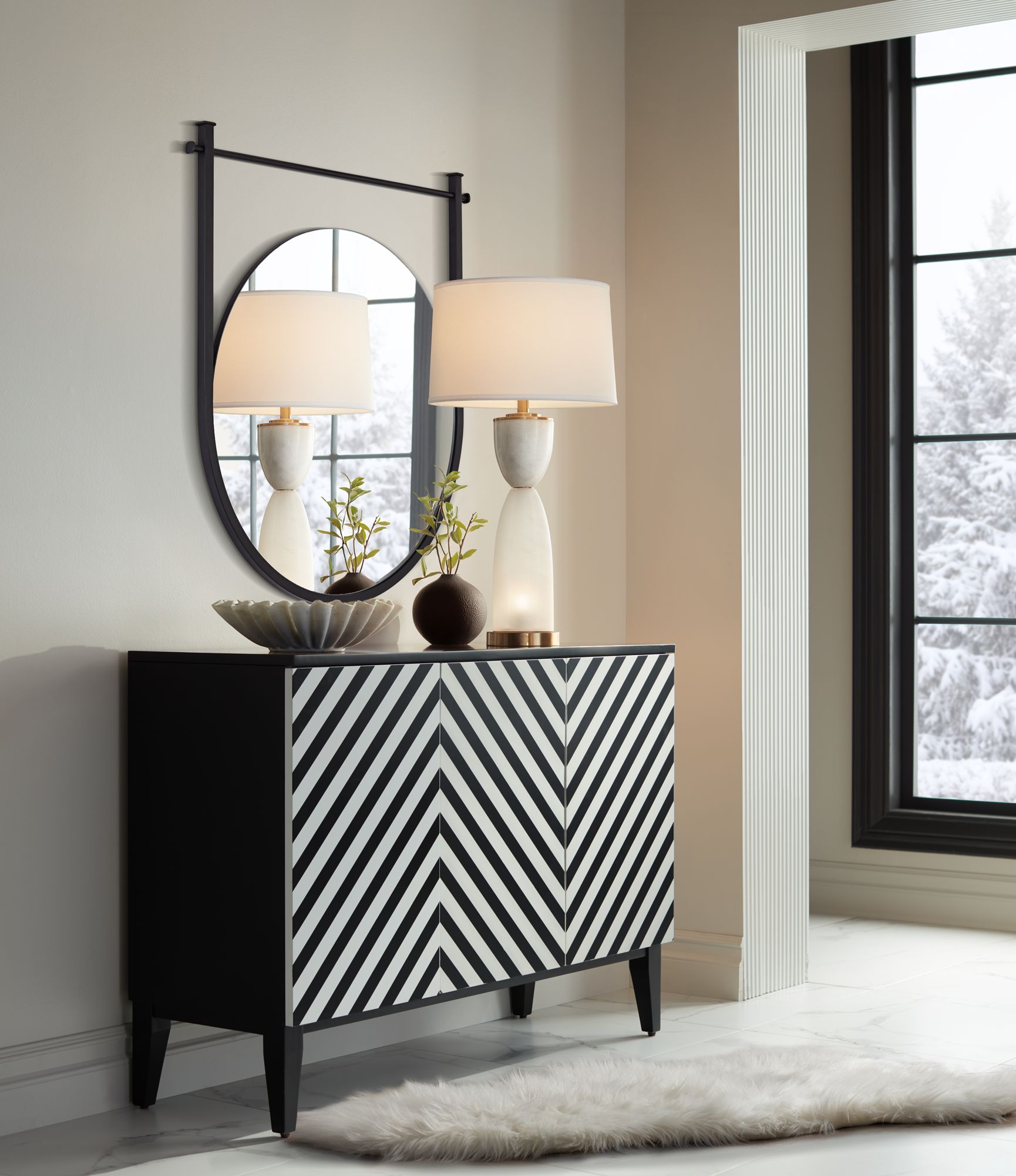 Uttermost Nassau 30x33 Black Round Wall Mirror in scene