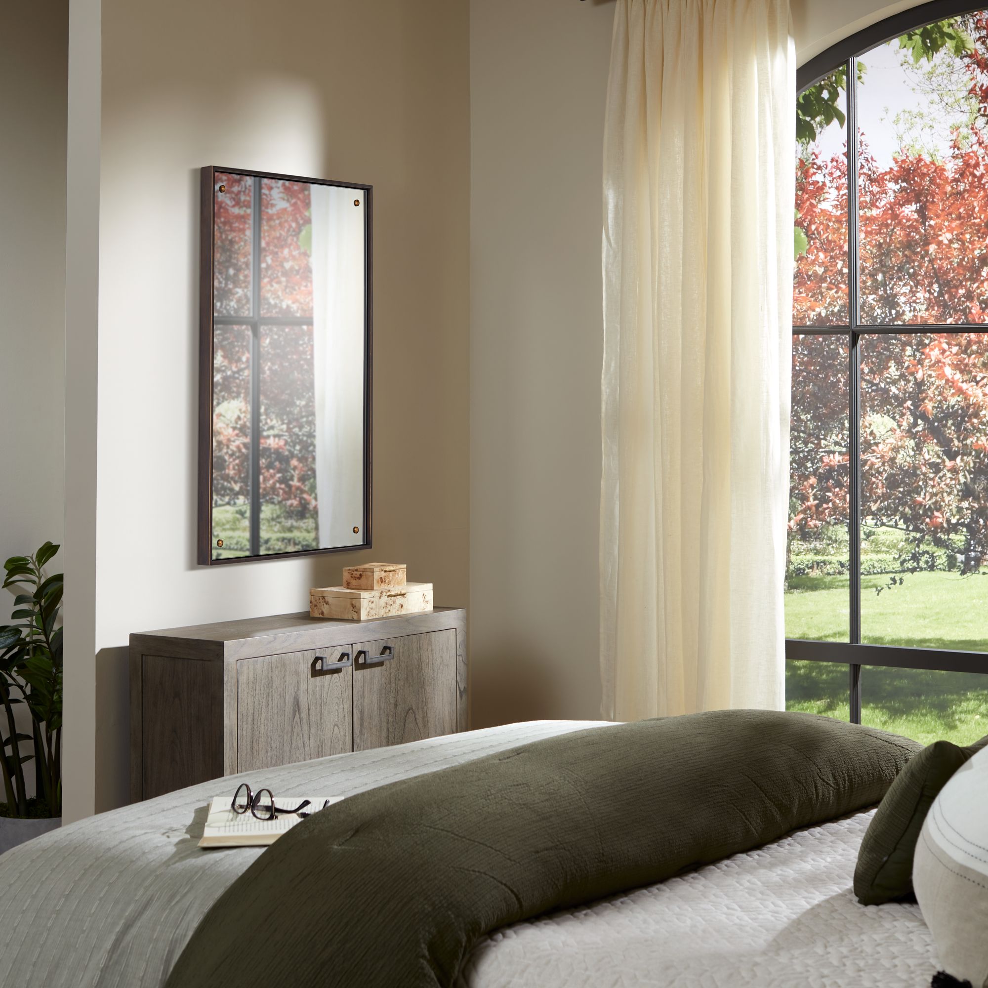 Uttermost Batavia 24x38 Dark Bronze Wall Mirror with Button Detail in scene