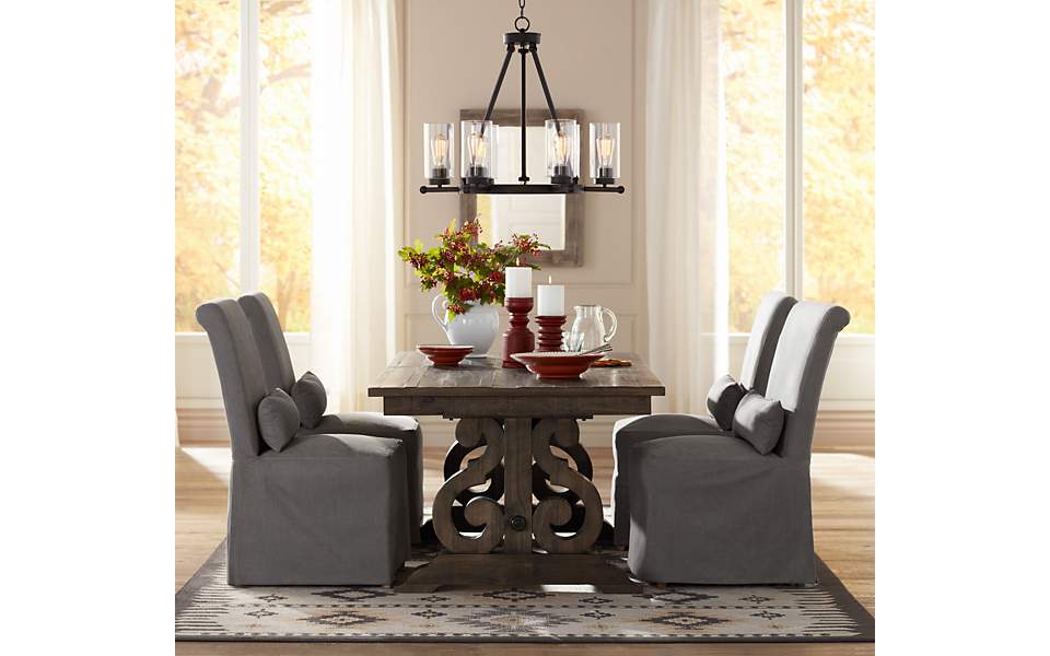 An image of a traditional dining room area with an industrial chandelier