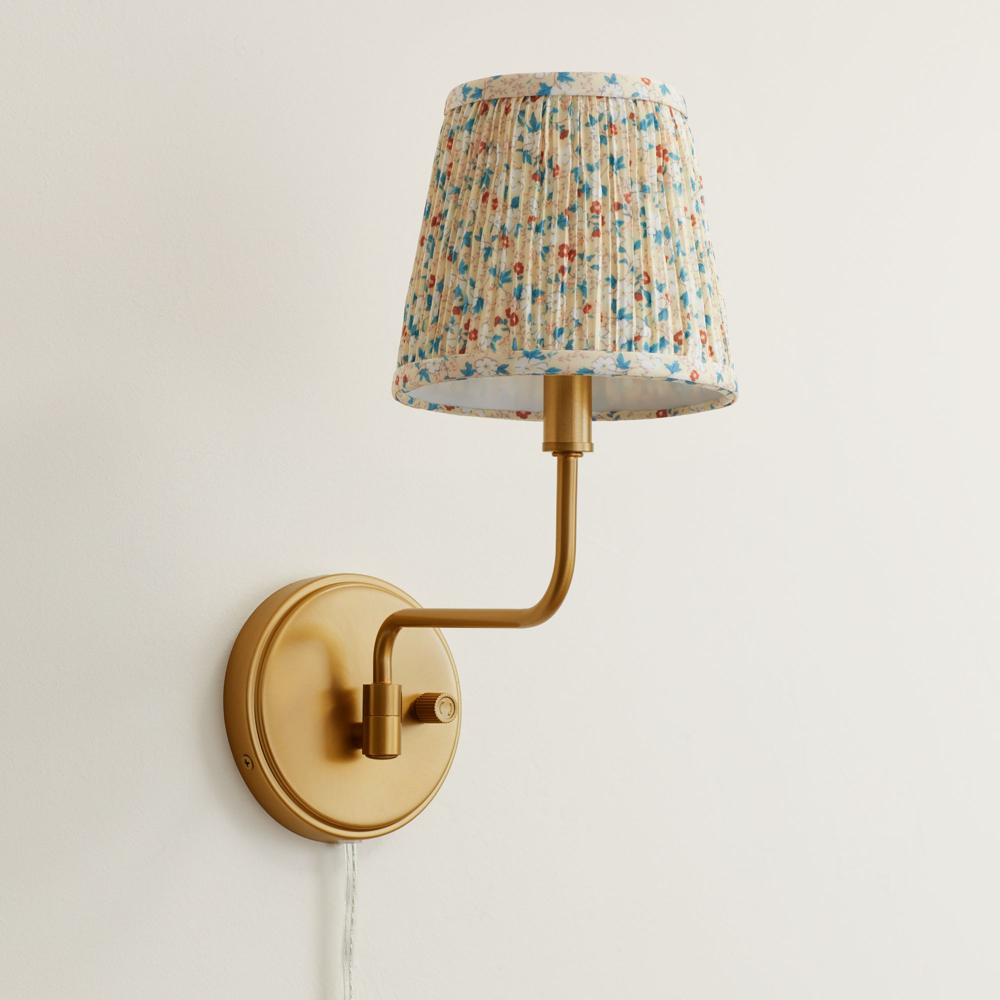 Image 1 Ophelia 9 1/2"H Warm Brass Plug-In Floral Pleated Shade Wall Sconce in scene
