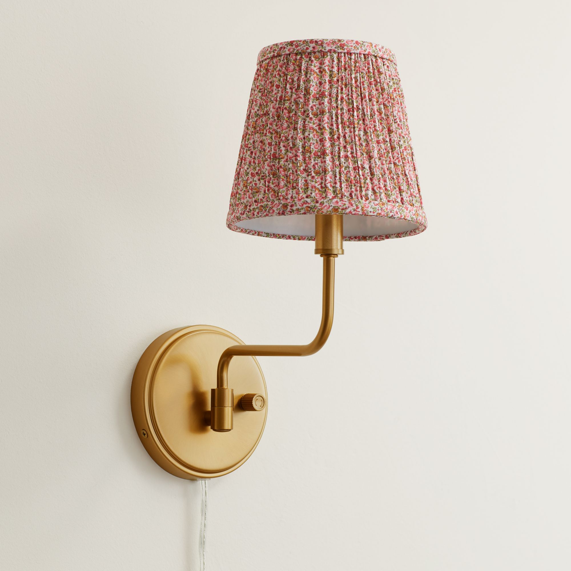 Thumbnail1 of Ophelia 9 1/2"H Warm Brass Plug-In Wall Sconce Pink Floral Shade in scene