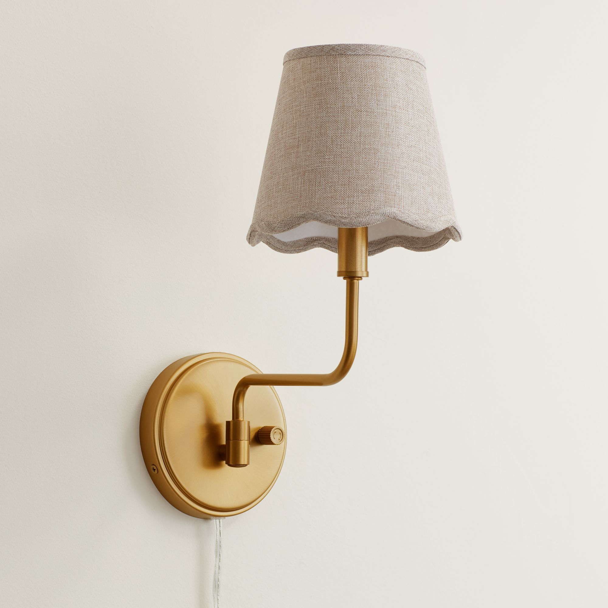 Thumbnail1 of Ophelia 9 1/2"H Warm Brass Plug-In Wall Sconce Beige Scallop Shade in scene