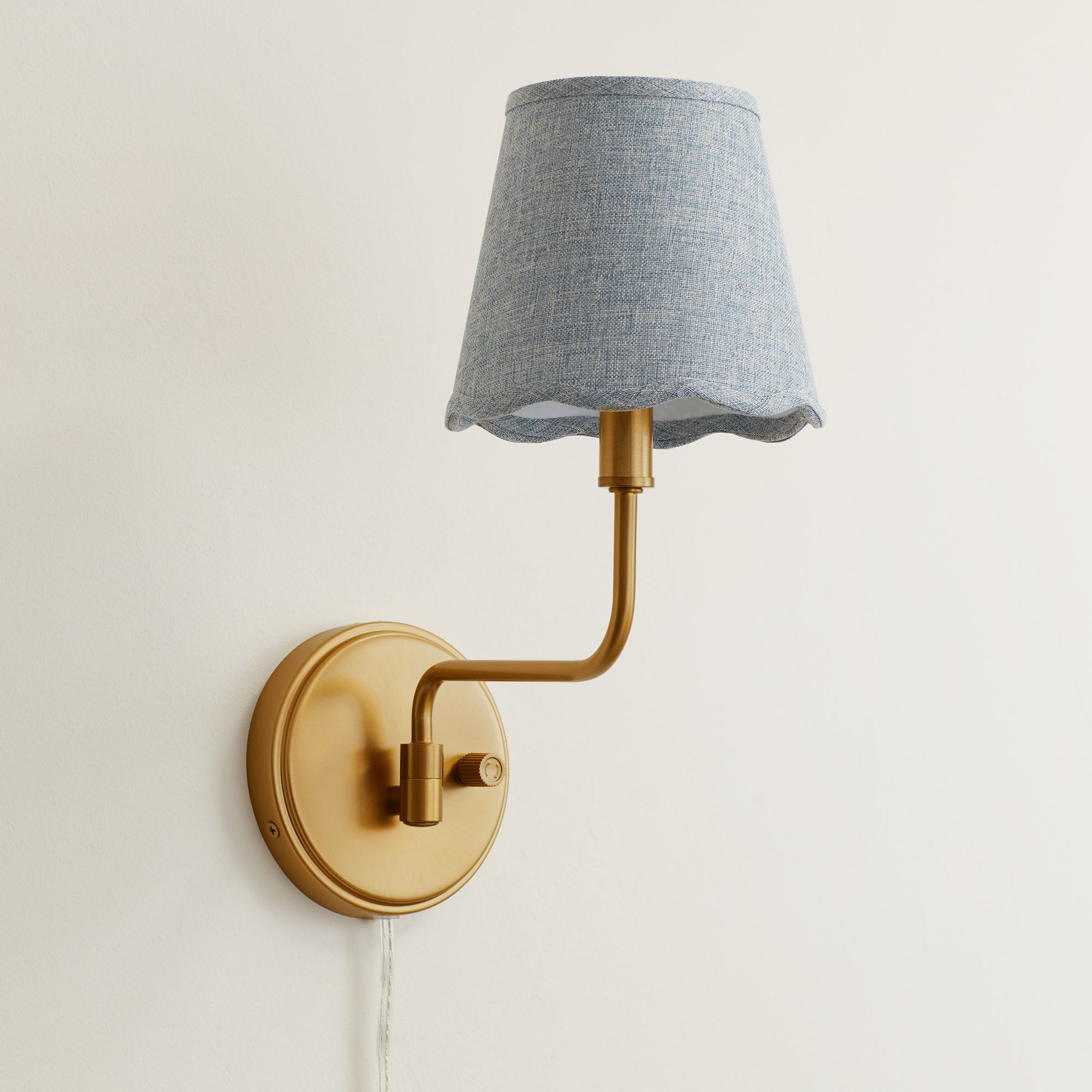 Image 1 Ophelia 9 1/2"H Warm Brass Plug-In Wall Sconce with Gray Scallop Shade in scene