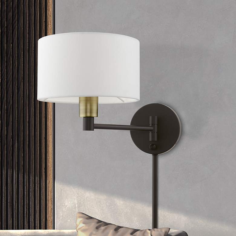 Image 1 1 Light Bronze with Antique Brass Accent Swing Arm Wall Lamp