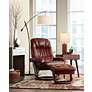 Kyle Ruby Red Faux Leather Ottoman and Swiveling Recliner in scene