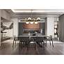1_Eclipse 43"W Brass and Clear Glass 7-Light Linear Chandelier in scene