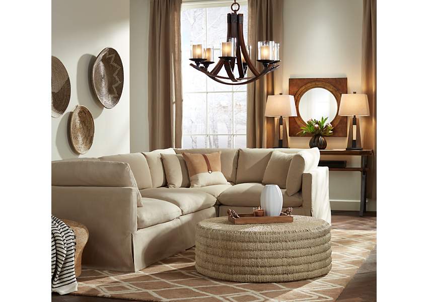 An over-sized tufted sofa is the centerpiece of this comfortable living  room.