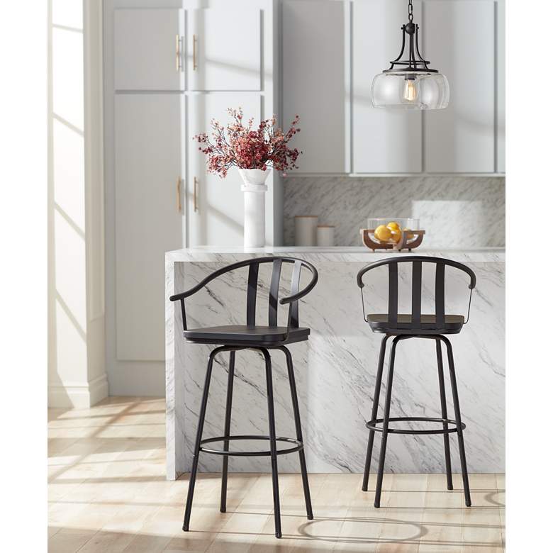 Image 1 Lael 25 1/4" High Black Metal and Wood Swivel Counter Stool in scene