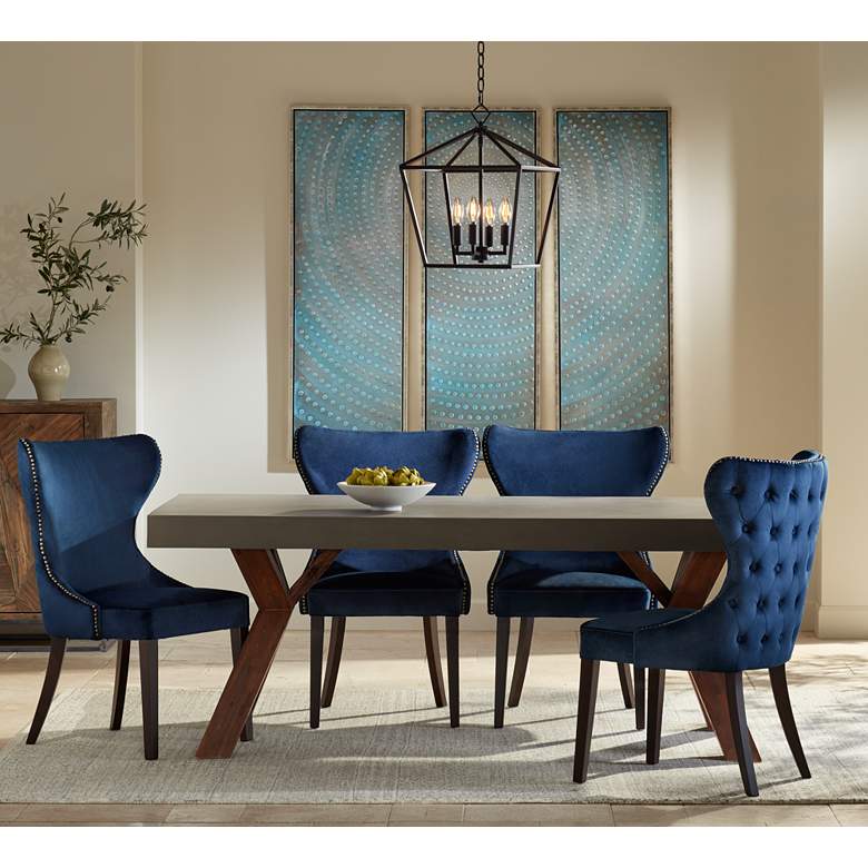 Ariana Antique Brass Trimmed Navy Blue Velvet Dining Chair in scene