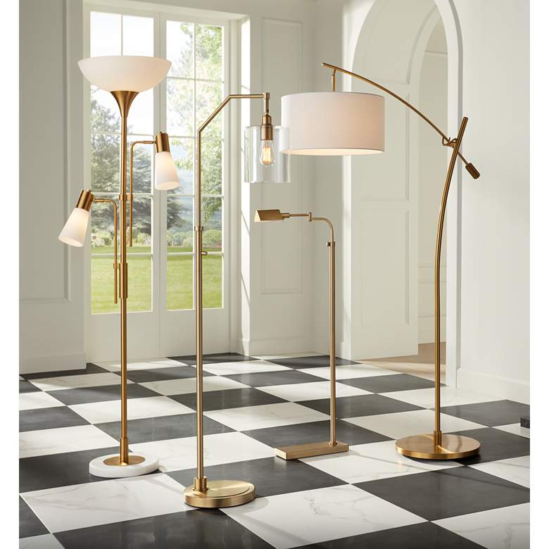 Image 1 Possini Euro Raymond Warm Gold Adjustable Boom Arc Floor Lamp in scene